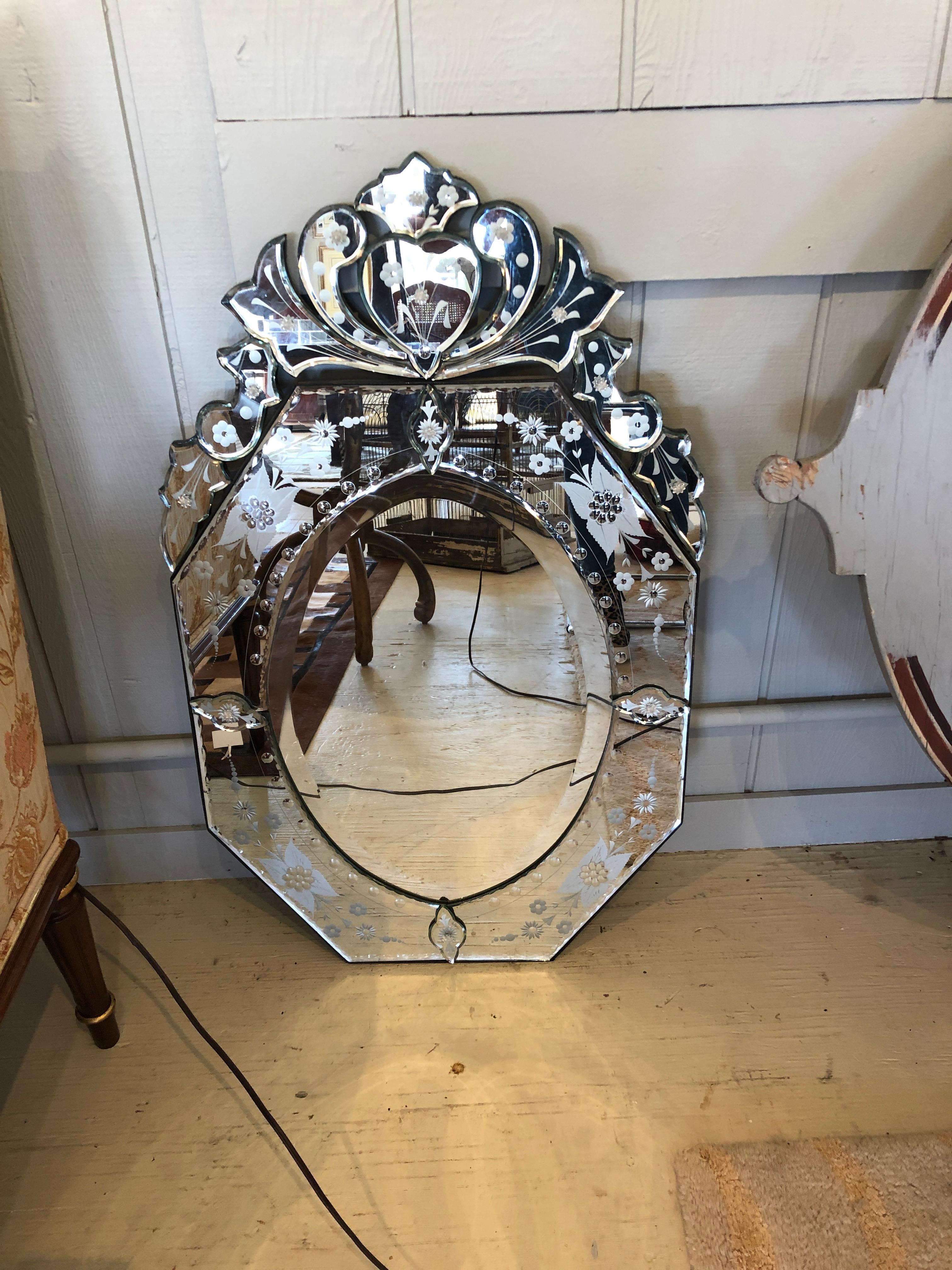 A medium sized glamorous Venetian style mirror with very pretty ornate etching.