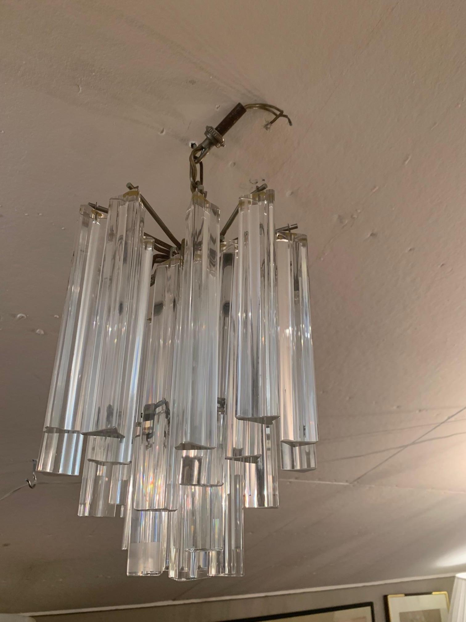 Brass Glitzy Mid-Century Modern Chandelier with Crystal Hanging Columns Prisms For Sale