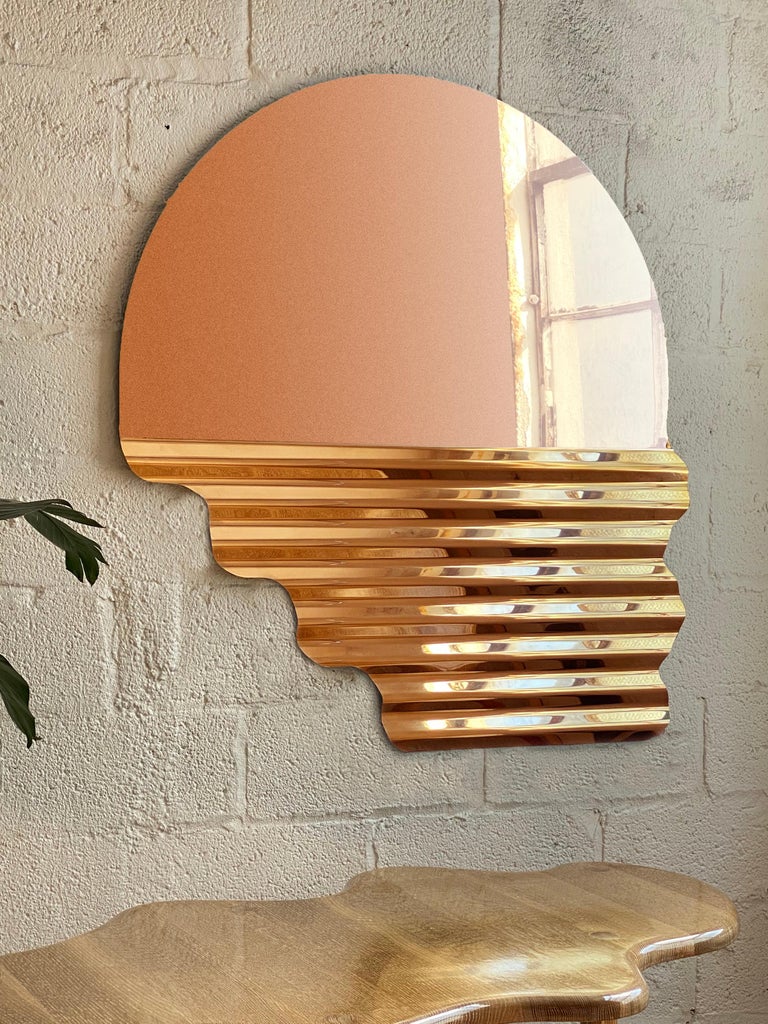The gloaming mirror is a large accent wall mirror made of a single sheet of architectural grade stainless steel mounted to a wall cleat. Arcana's work is much about the adaptive misuse of materials through exploration as seen with this piece. The