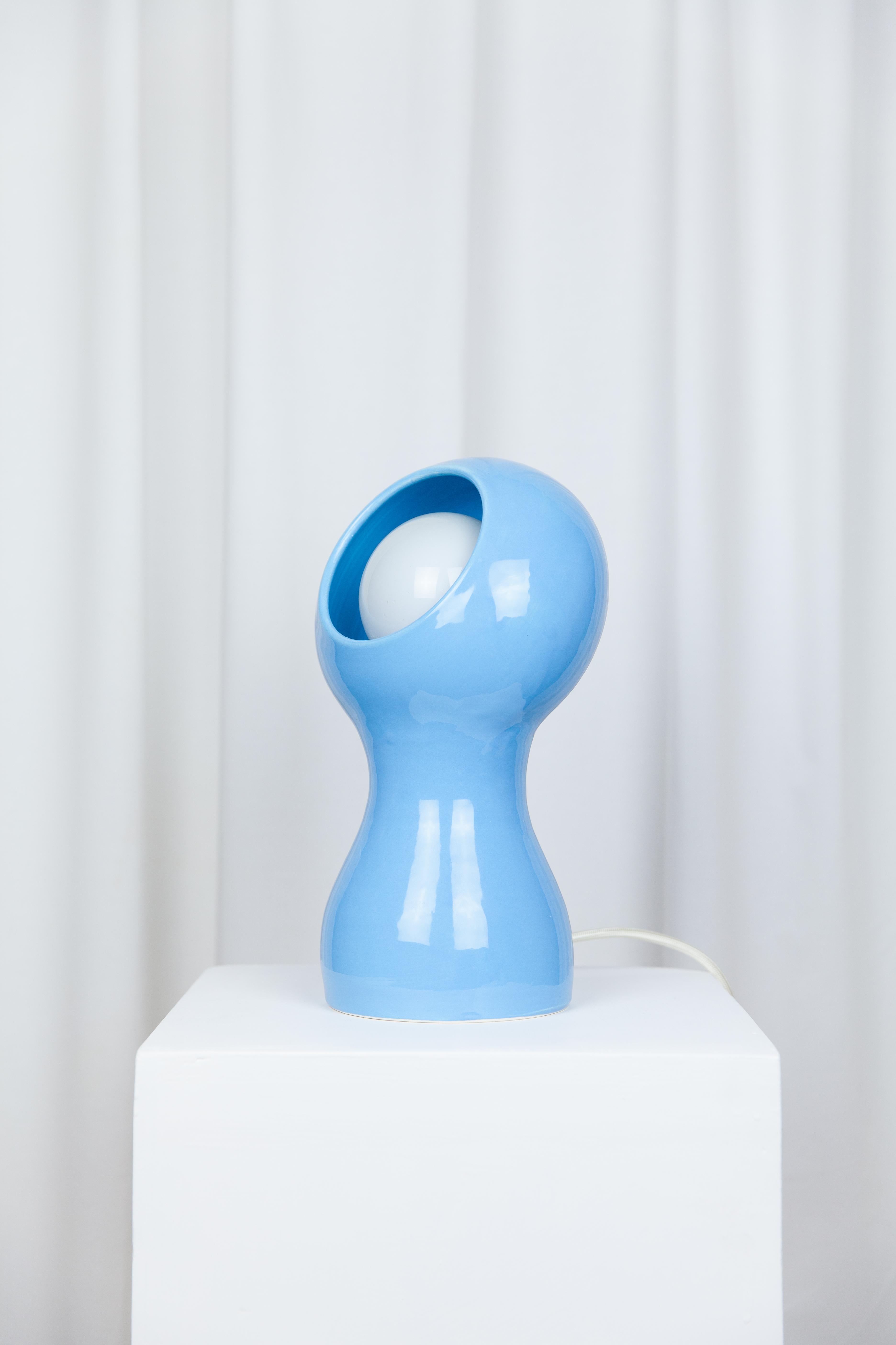 Glob Blue lamp by Lola Mayeras
Dimensions: D18 x W 15 x W 32 cm
Materials: Earthenware.
Other colors available.

Lamp in white earthenware, glazed in blue.
This piece is designed and handcrafted in the south of France.

All our lamps can be