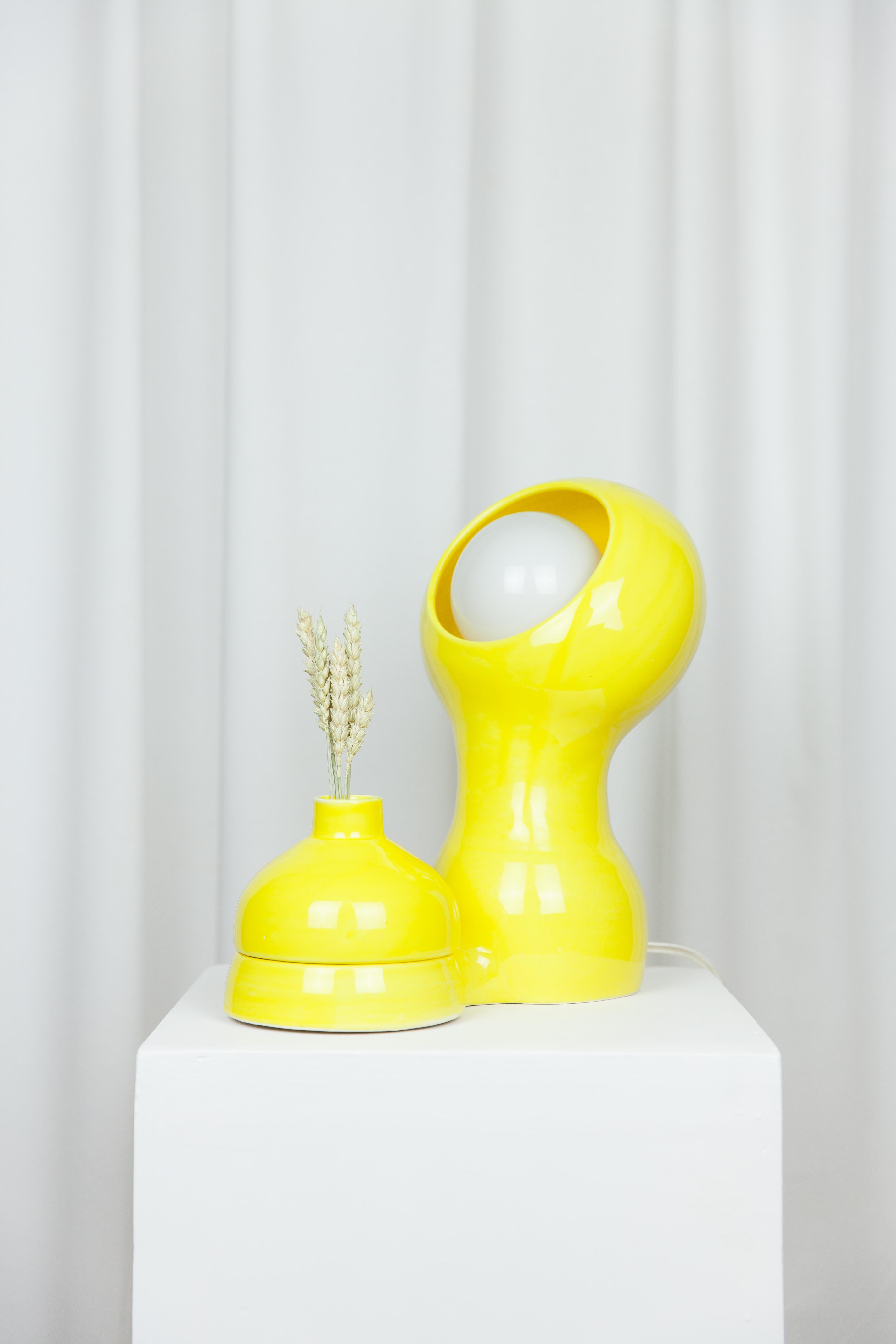 Glob Yellow Lamp + Vase by Lola Mayeras
Dimensions: D29 x W 18 x W 32 cm
Materials: Earthenware.
Other colours available.

Lamp with detachable vase, white earthenware, glazed in yellow.
This piece is designed and handcrafted in the south of