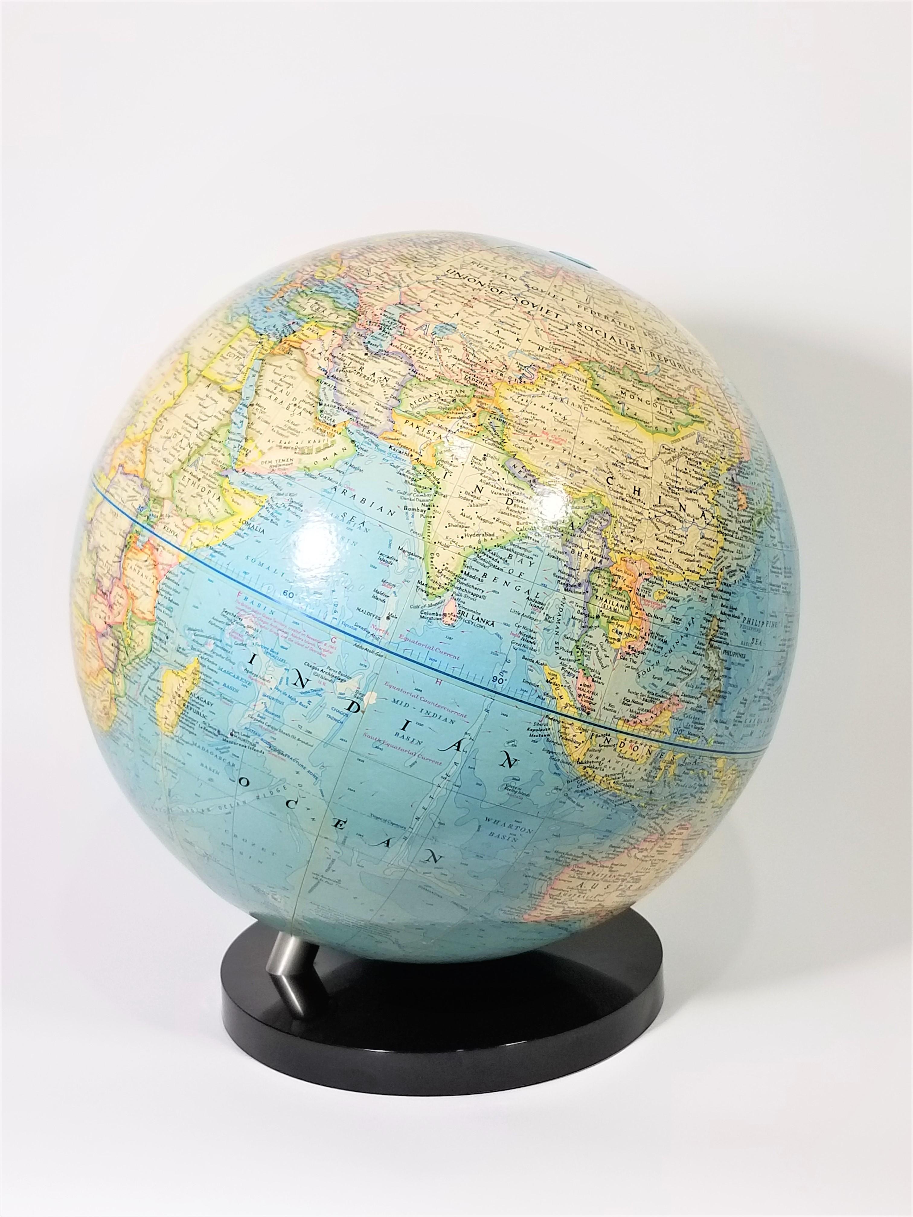 1976 National Geographic world globe. Black lucite base.