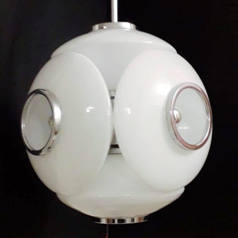 Vintage Italian mid-century globe chandelier with milky white Murano Glass shades mounted on chrome frame / Made in Italy circa 1960s
Measurement: diameter 16 inches, height 21.5 inches, total height 25 including adjustable cable and original