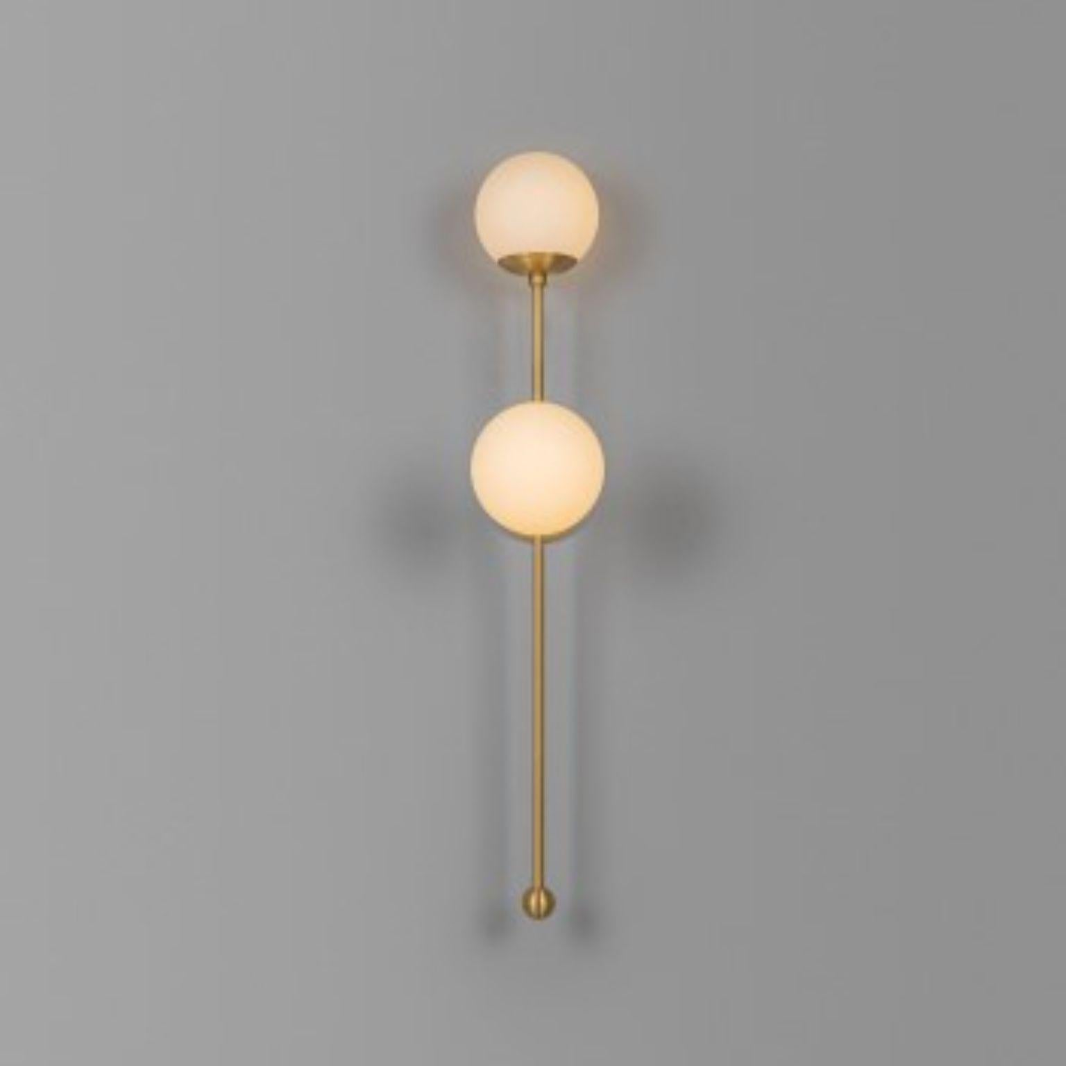 Globe Dual Wall Sconce by Schwung
Dimensions: W 15 x D 33 x H 92.2 cm
Materials: Brass, Opal glass
Weight: 2.1 kg

Finishes available: Black gunmetal, polished nickel, brass
Other sizes available.

 Schwung is a german word, and loosely