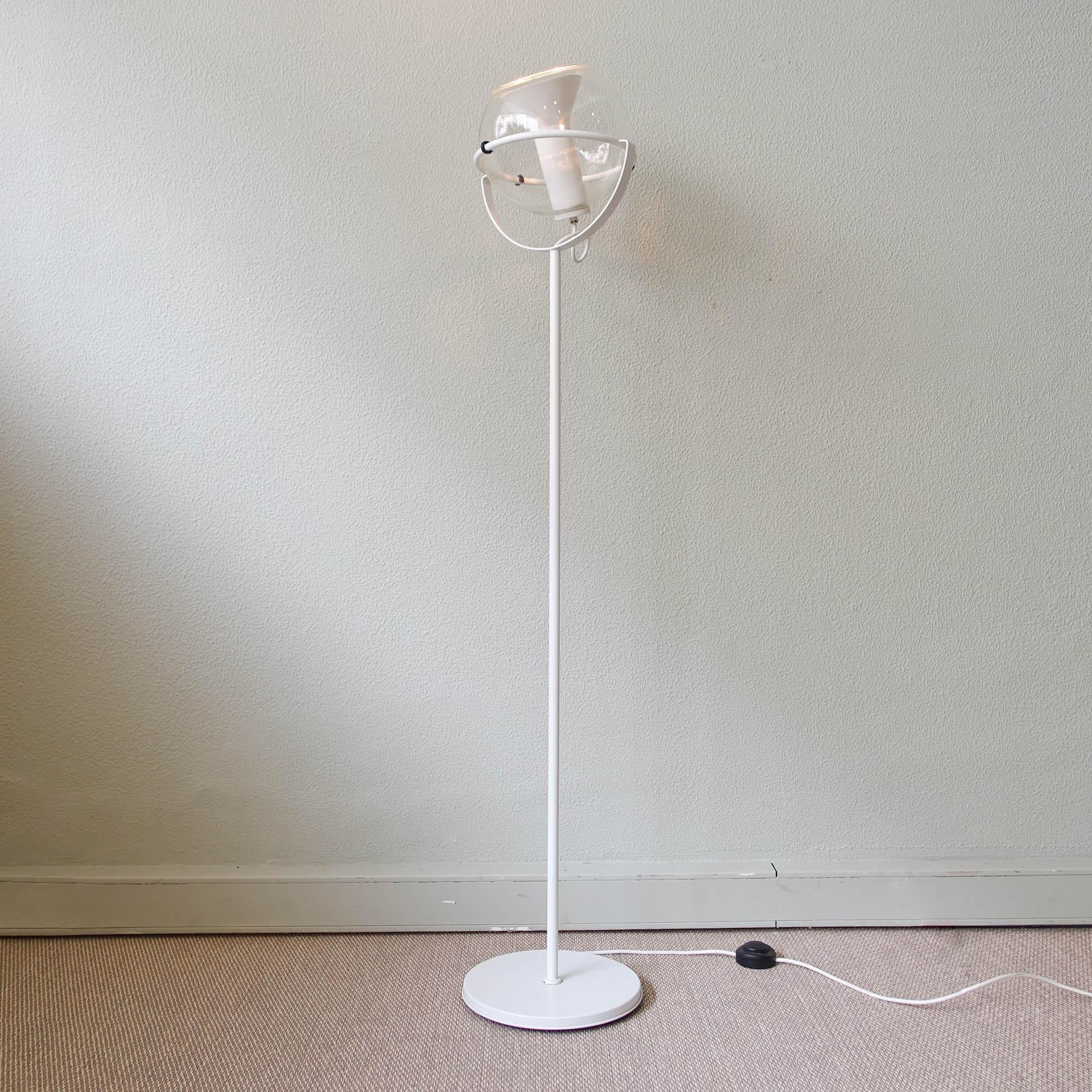 This floor lamp, model Globe, was designed in the late fifties by Frank Ligtelijn, a jewellery designer, for Raak, in Holland. It was a big success and they were produced for many years. The glass globe of this Raak globe floor lamp was used for