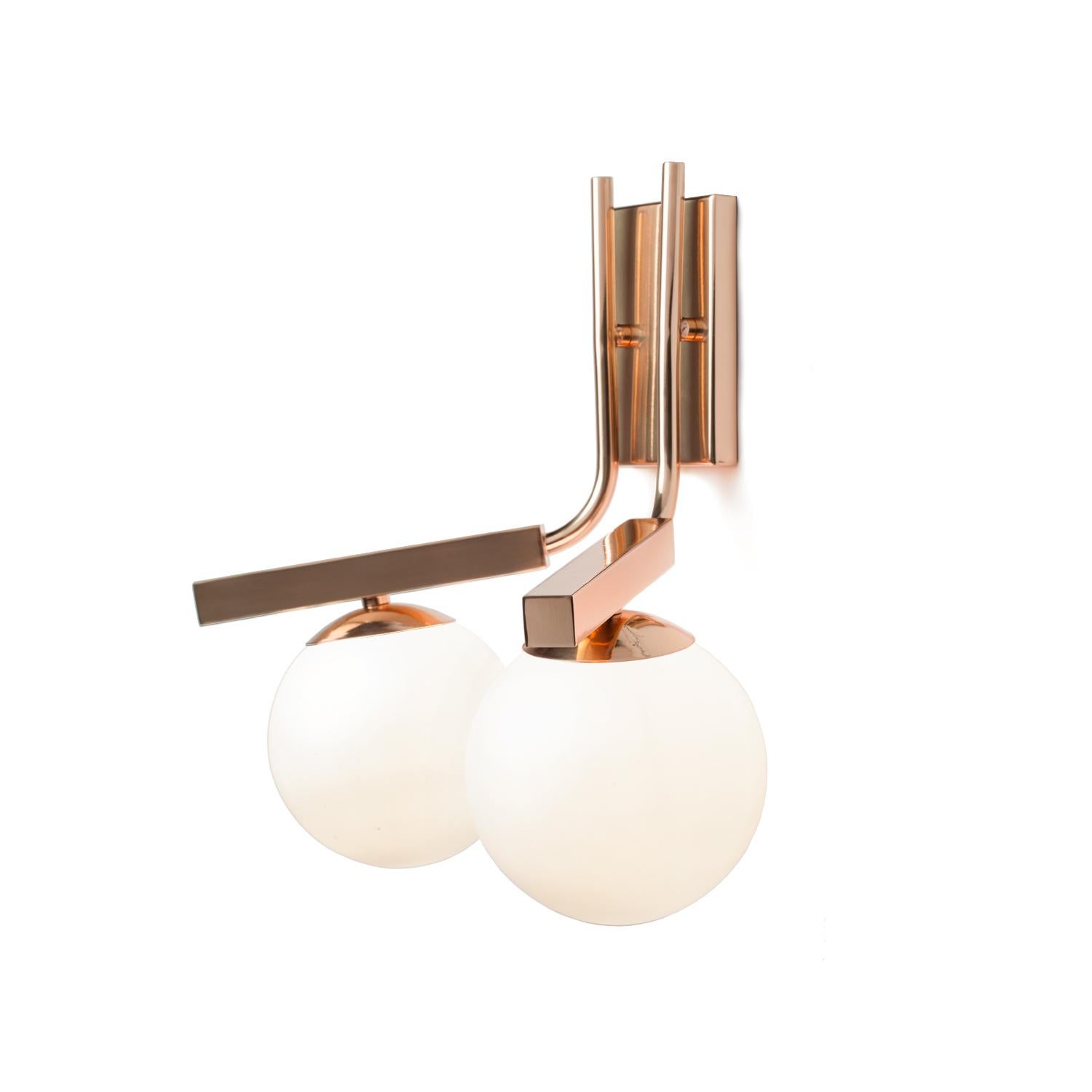 Globe Wall II Sconce is a stunning, timeless lamp with a delicate brass metal structure and soft opal glass globes. Other finishes available.
Made to Order. 

Part of the Mambo Unlimited Ideas design group, at Utu lamps the lighting field of design