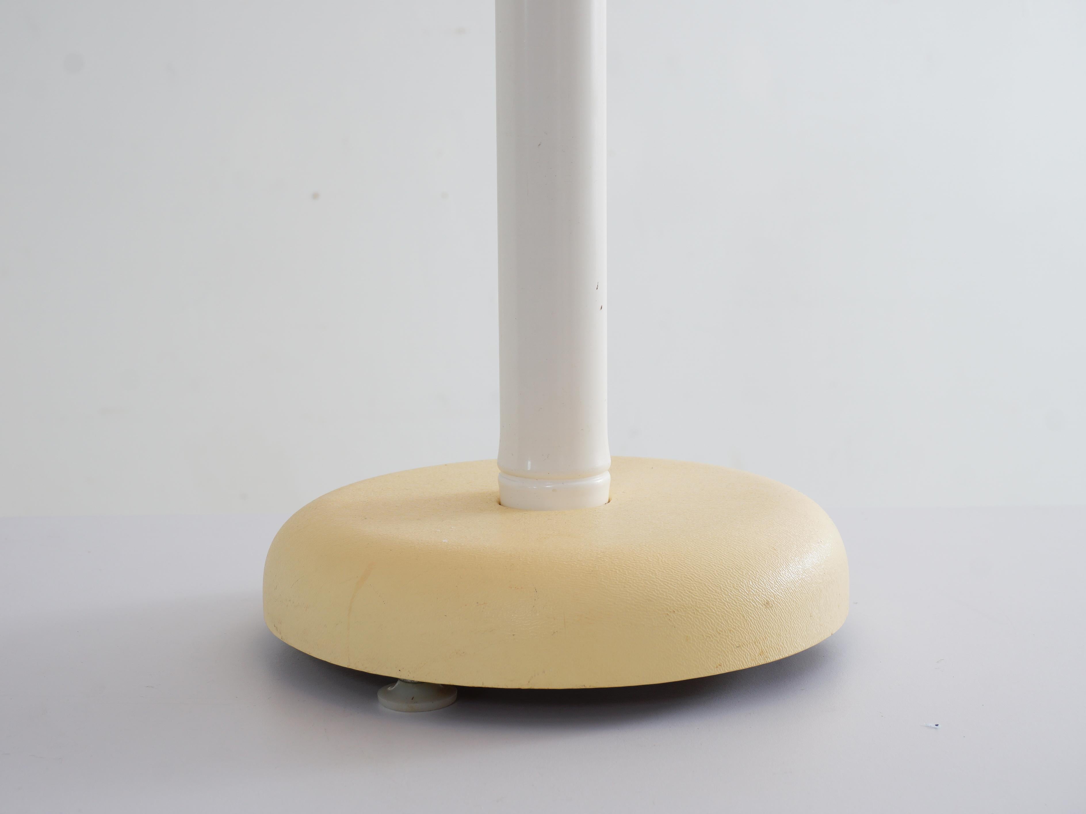 The Olympia Lunar globe lamp, a luminary masterpiece from the swinging 60s, marries form and function in perfect harmony. Its spherical shade diffuses a soft, ethereal glow, casting a captivating ambiance in any space. It's a quintessential piece of