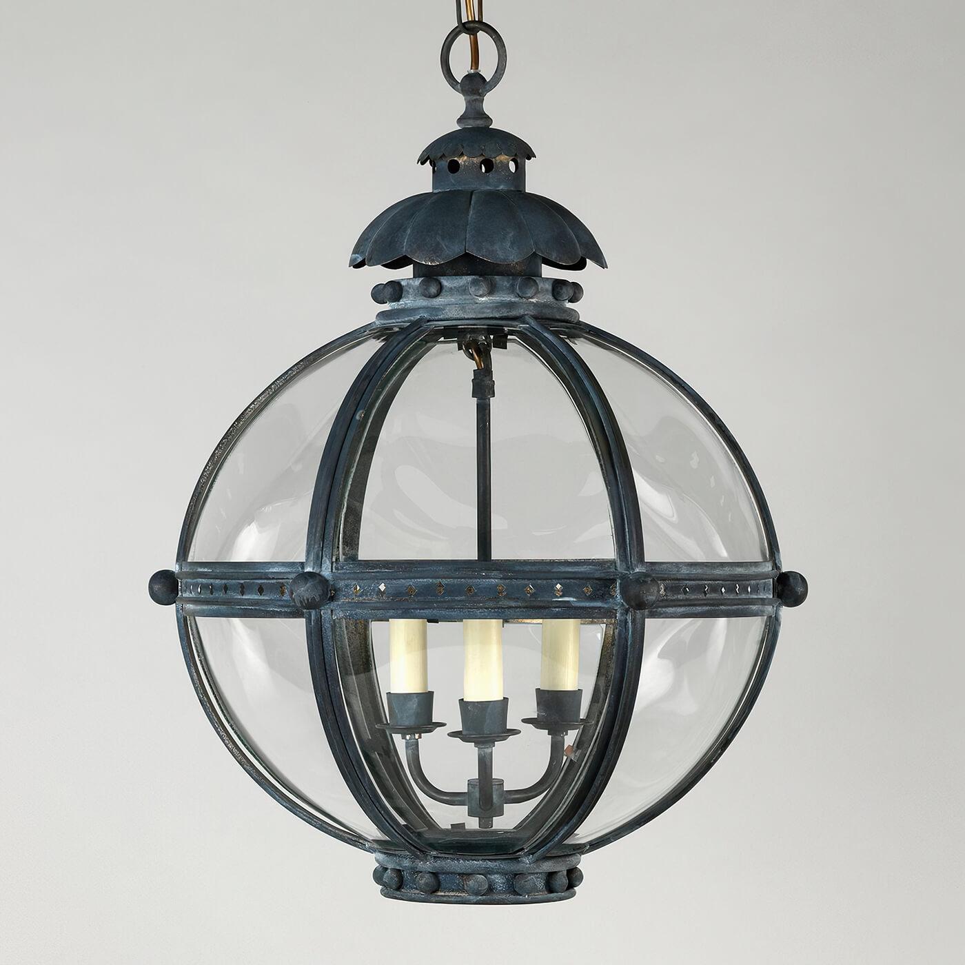 The Globe Lantern is based on a similar 19th-century antique. The globe shape of the fixture emanates strength and is united by the solid zinc finish finials and acanthus top.

The lantern is hand-fabricated from bronzed brass and curved glass