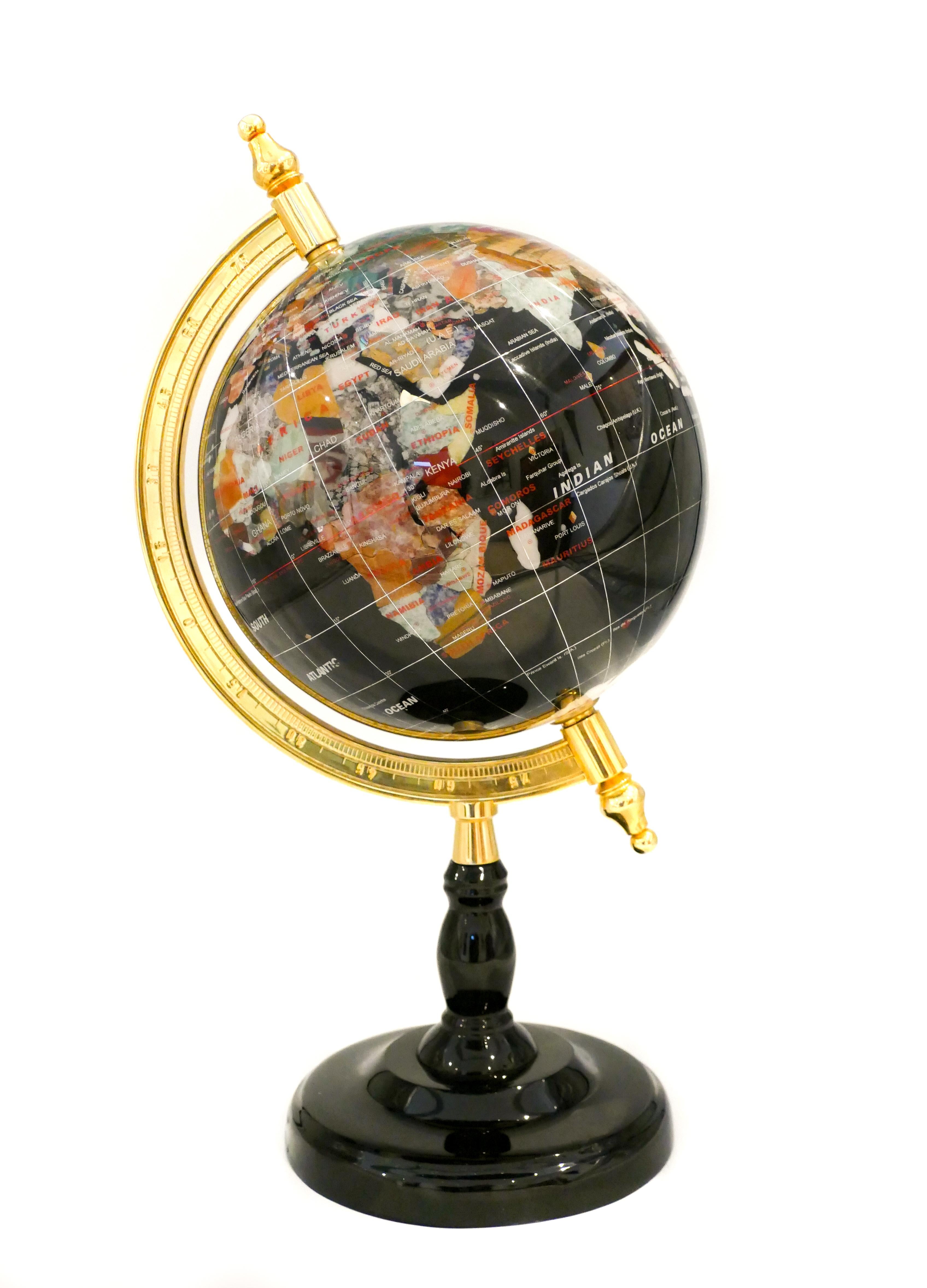 Terrestrial globe, realized in the late 20th century in plastic to imitate hard stones, with the golden metal axis and black resin base.
In very good condition

 This object is shipped from Italy. Under existing legislation, any object in Italy