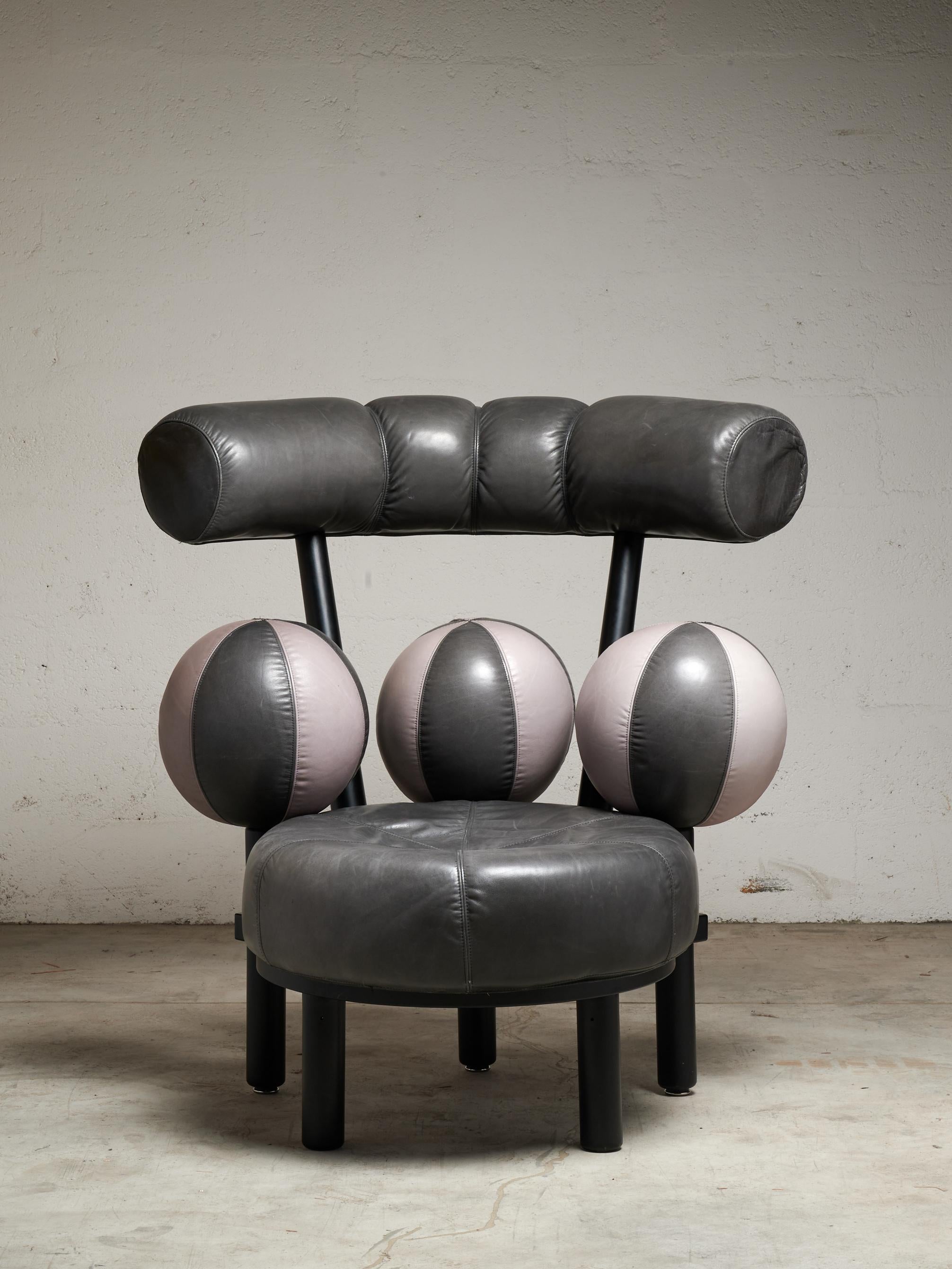 A collectible Scandinavian modern lounge chair by Peter Opsvik, this 1980s Globe Chair features a sculptural, spherical cushion, upholstered in two tones leather. Its enveloping curves show Opsvik ergonomic concern with striking visual presence,