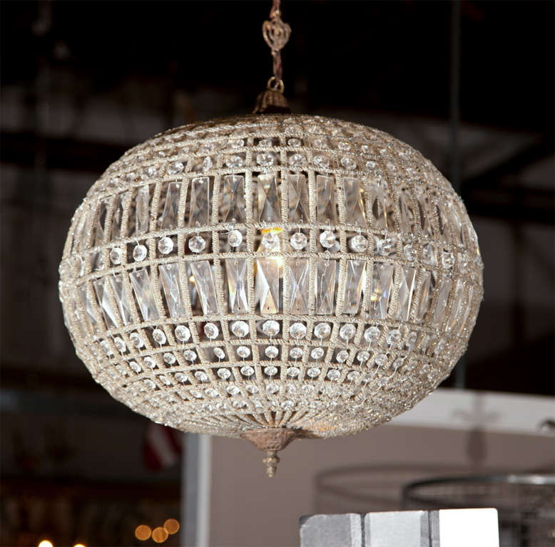 Exquisite globe pendant chandeliers, each in oval shape wired with crystals. Please note the pictures didn't show but they come with short chains and canopies. Can sell separately.