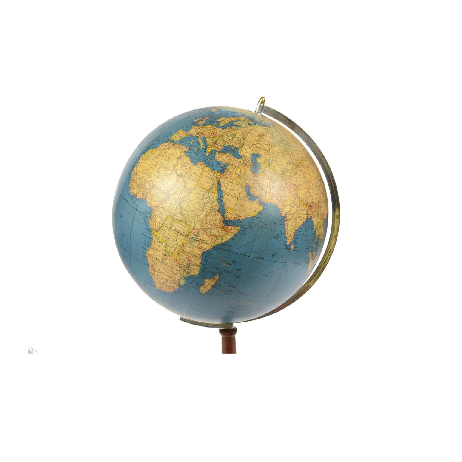 Terrestrial globe published in the late fourties by Vallardi publisher, designed and engraved by A. Minelli, papier mâché sphere covered with paper printed by emgraving on coper plate and watercolored, wooden base complete with engraved aluminum