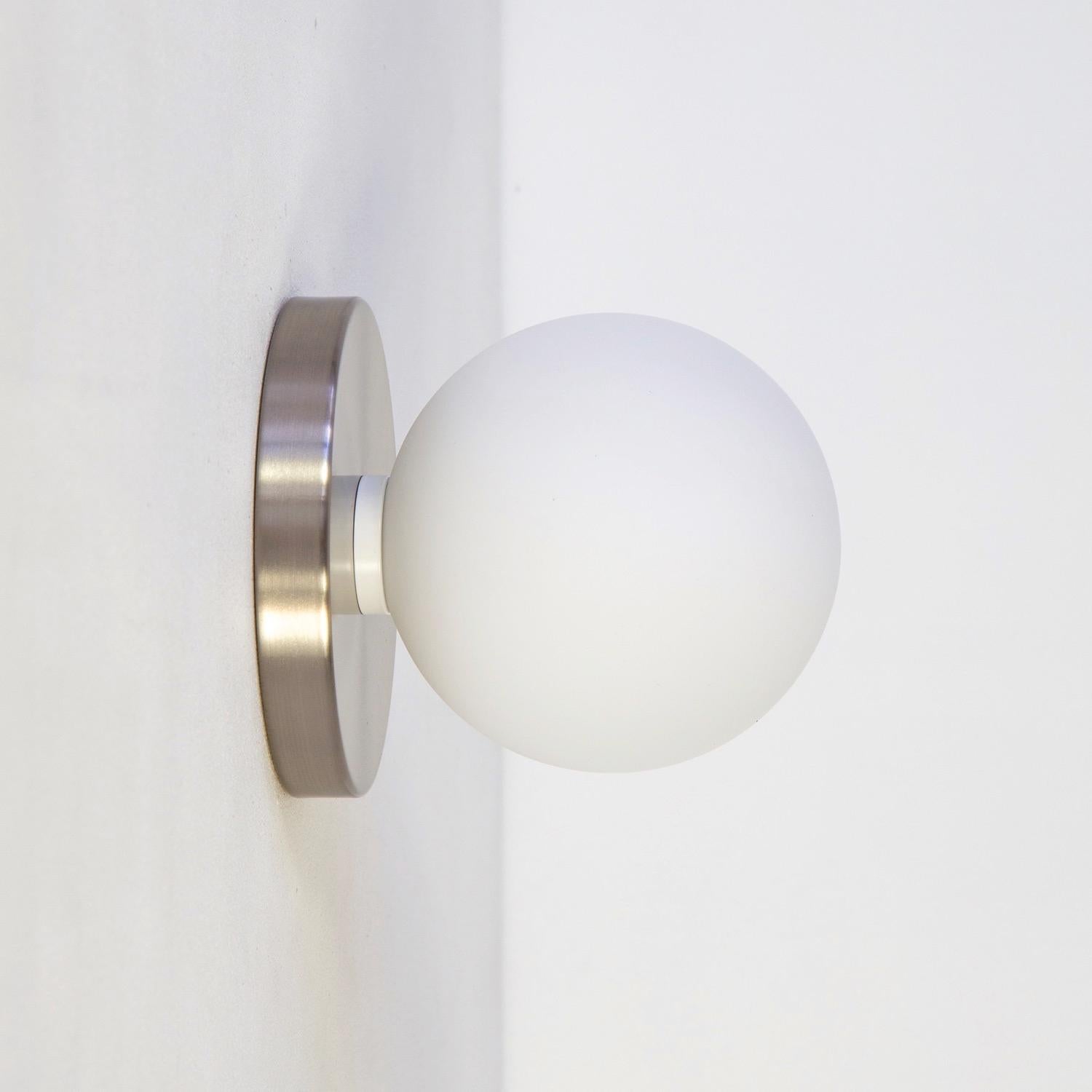 Modern Globe Sconce by Research.Lighting, Brushed Nickel, 5in Glass, In Stock For Sale