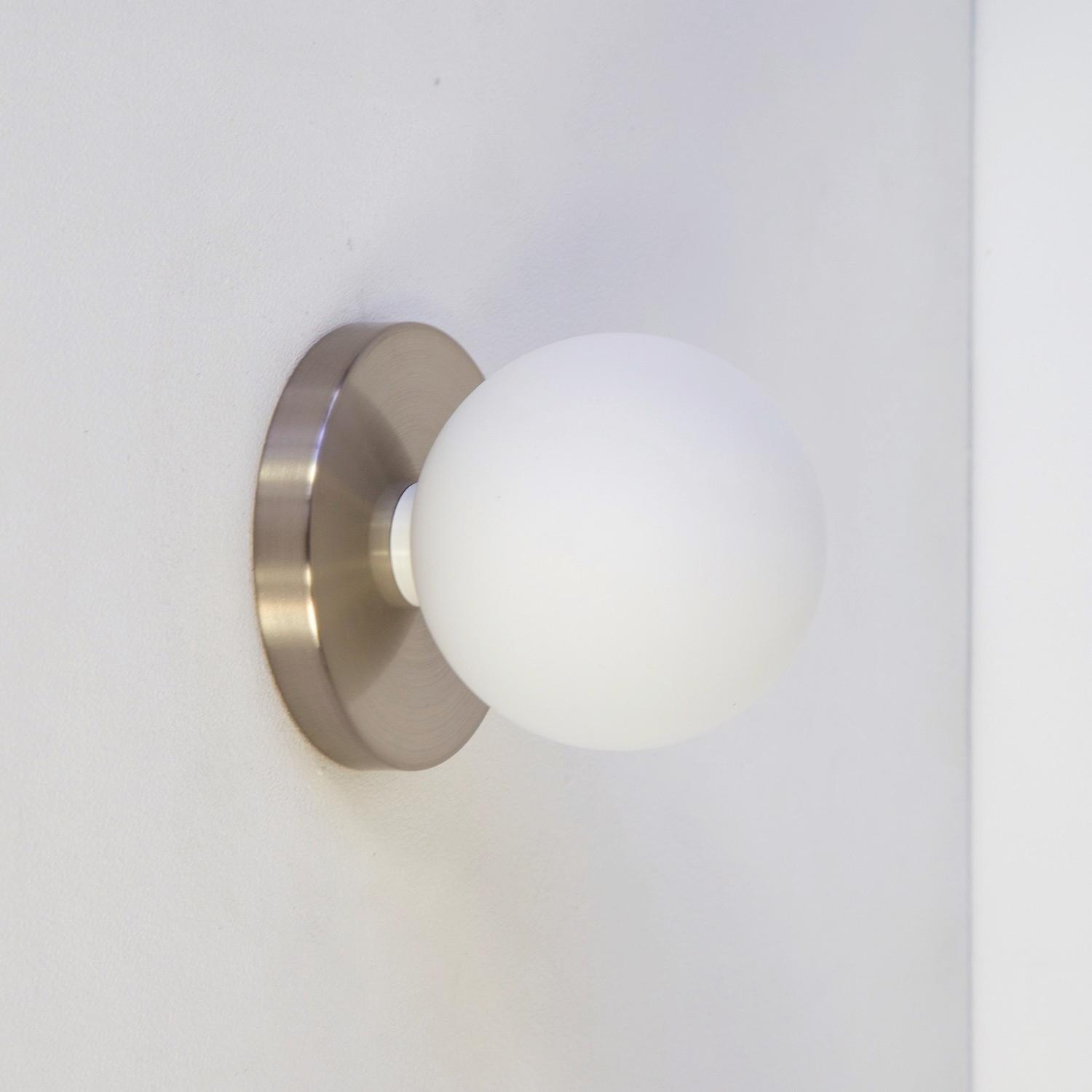 Contemporary Globe Sconce by Research.Lighting, Brushed Nickel, 5in Glass, In Stock For Sale