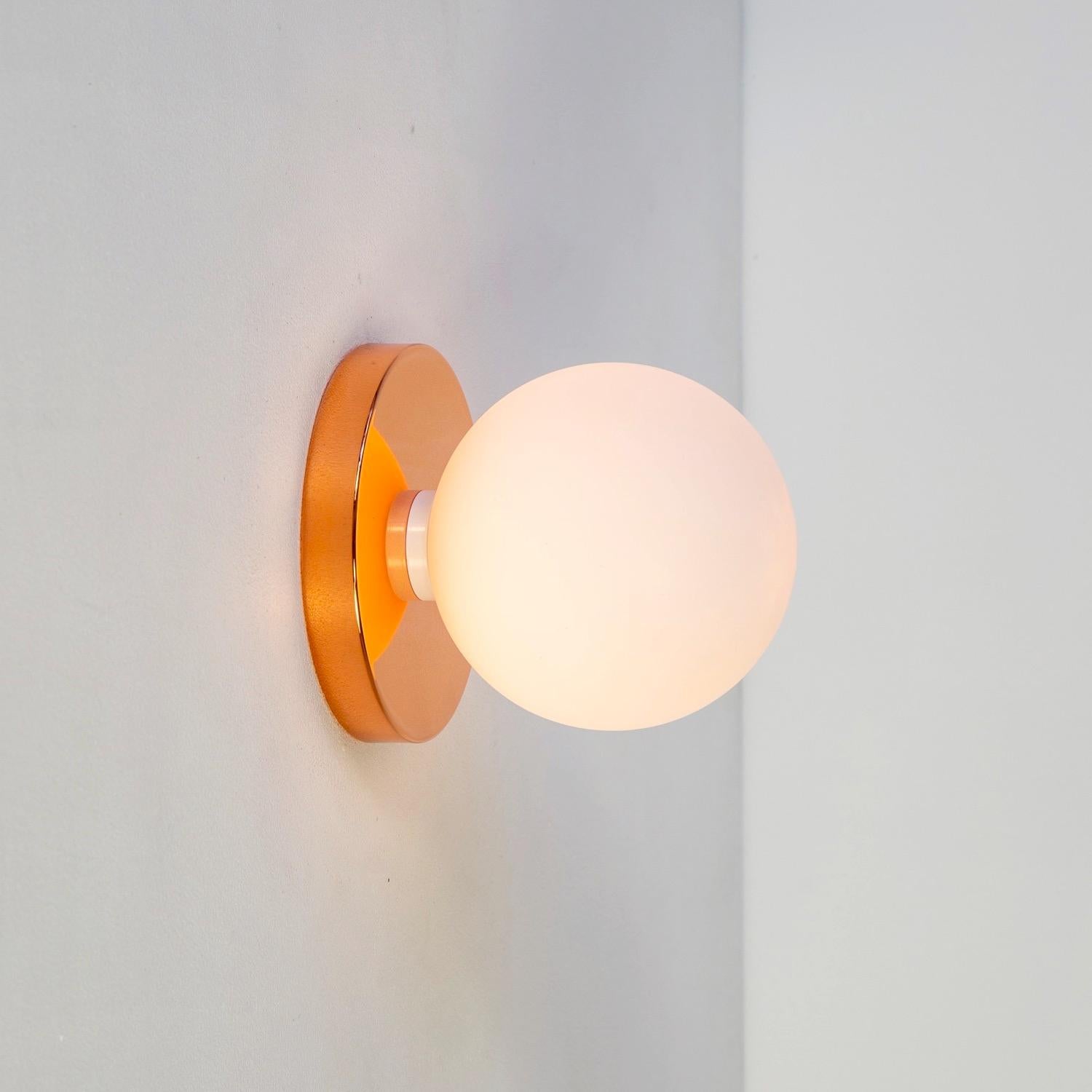 Plated Globe Sconce by Research.Lighting, Polished Copper, 5in Glass, In Stock For Sale
