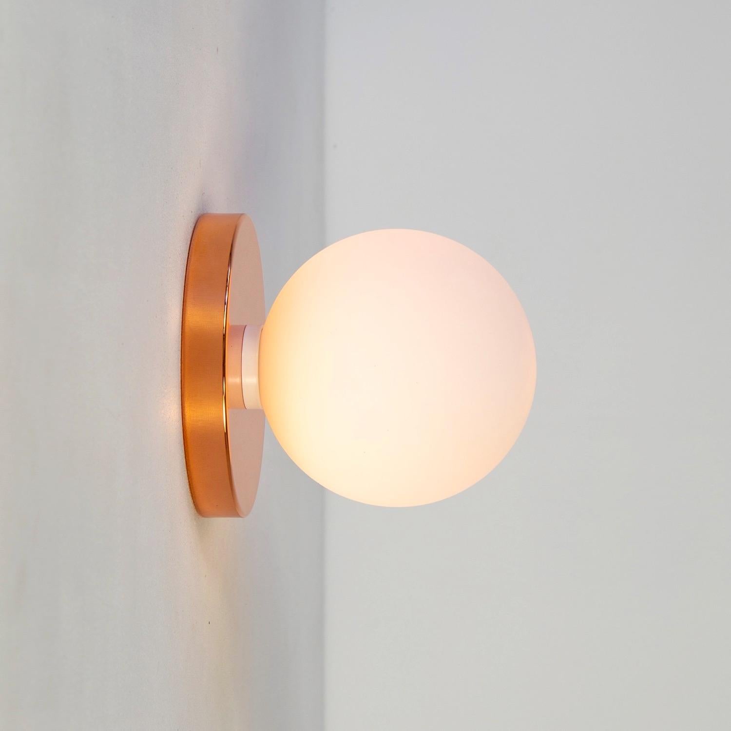 Globe Sconce by Research.Lighting, Polished Copper, 5in Glass, In Stock In New Condition For Sale In Brooklyn, NY