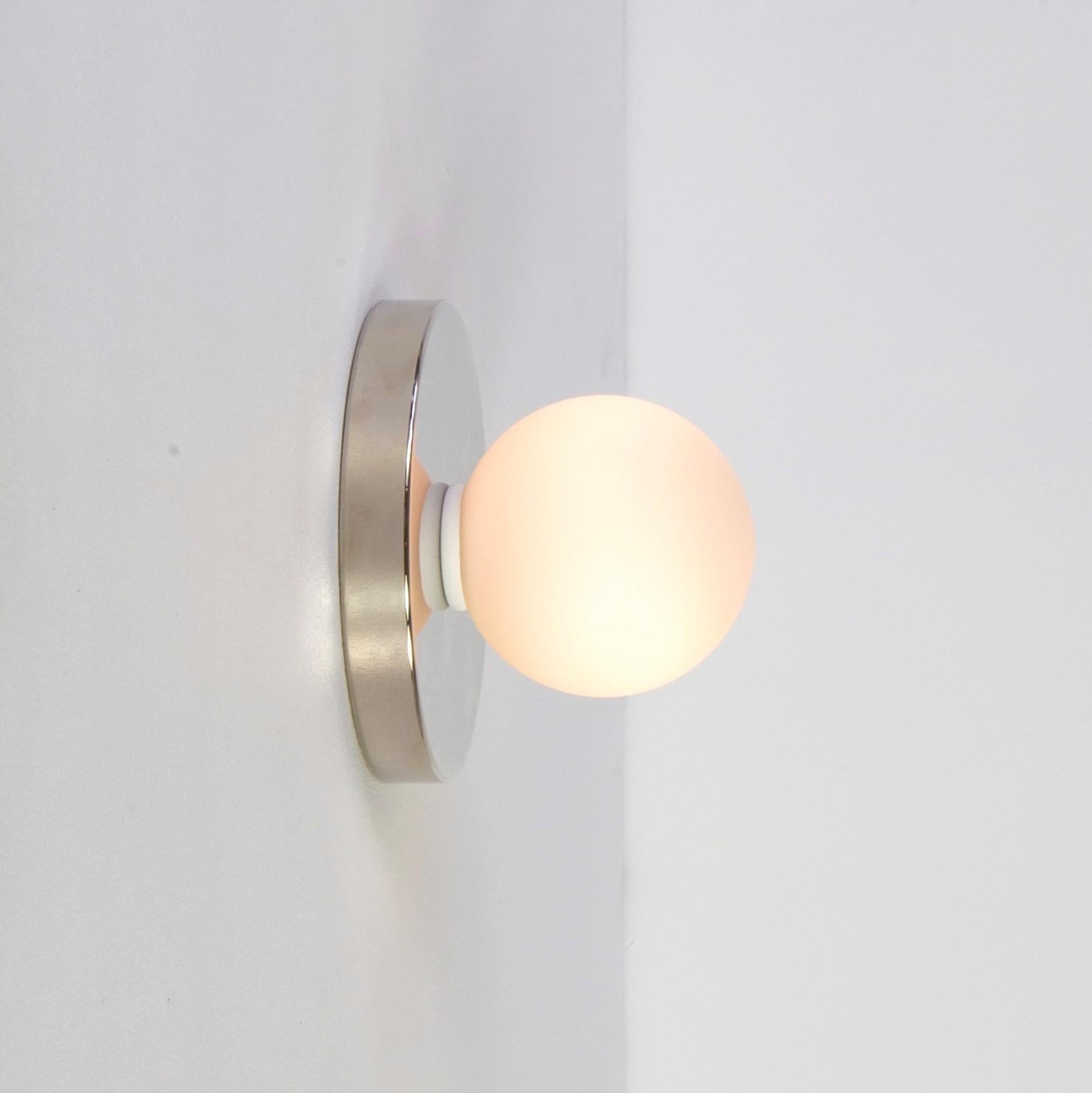 Globe Sconce by Research.Lighting, Polished Nickel, 3in Glass, In Stock In New Condition For Sale In Brooklyn, NY