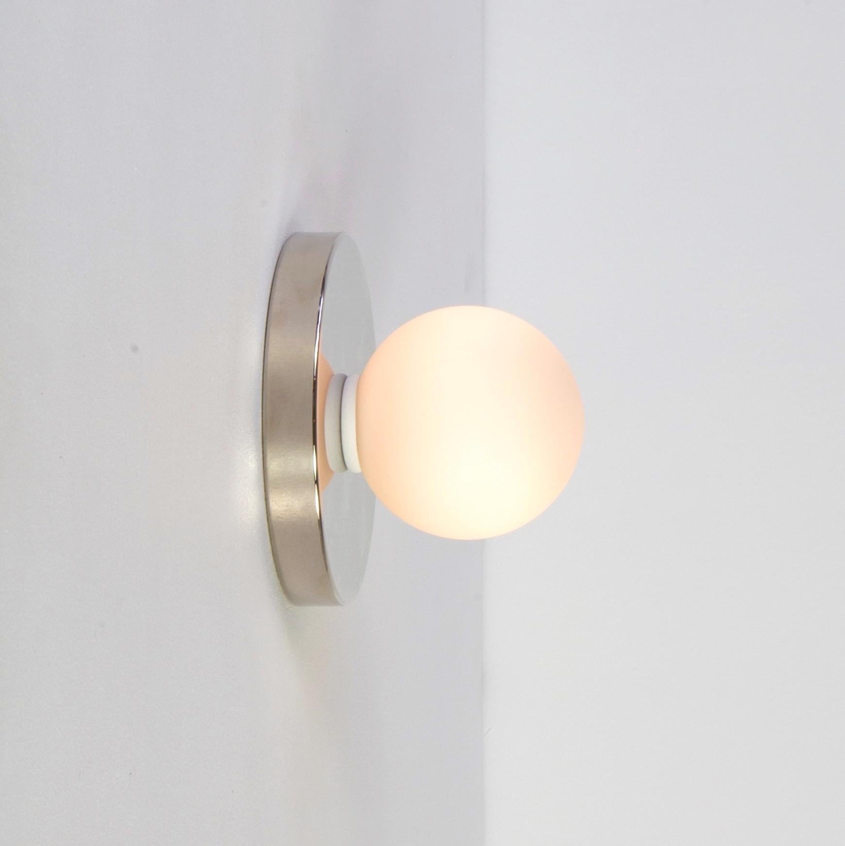 Globe Sconce by Research.Lighting, Polished Nickel, In Stock In New Condition For Sale In Brooklyn, NY