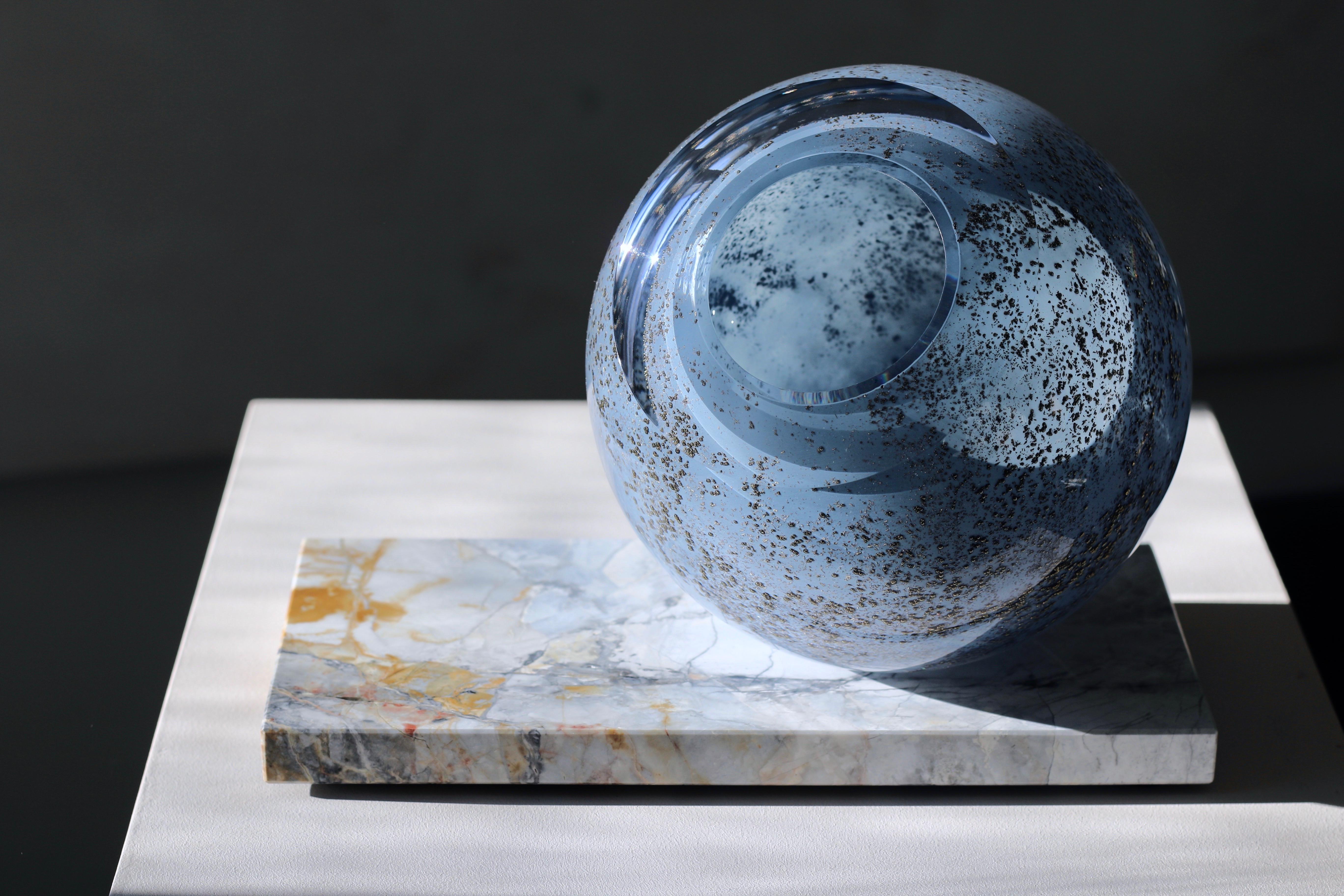 'Globe' large sculptural vase from collection 'Mother Eternity'
mouth blown glass in sky blue and gold tone 
Côte d'Azur marble
handcrafted 
highest quality, extra clear glass
unique piece, signature engraved

Classified as ‘art with function’,