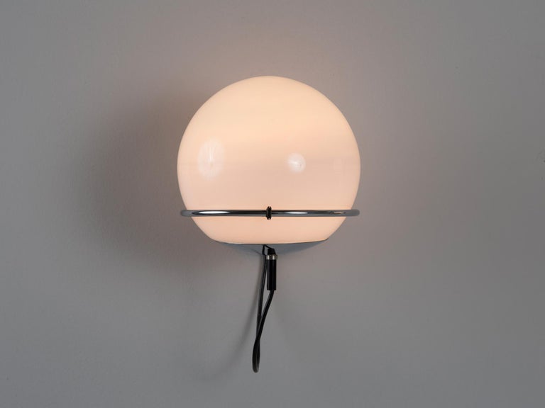Wall lights, opaline glass, chrome-plated metal, Europe, 1970s. 

These lovely wall lights are suitable for bringing more ambience in one's interior. The construction is based on a wall-mounted system that secures the silver colored ring. The