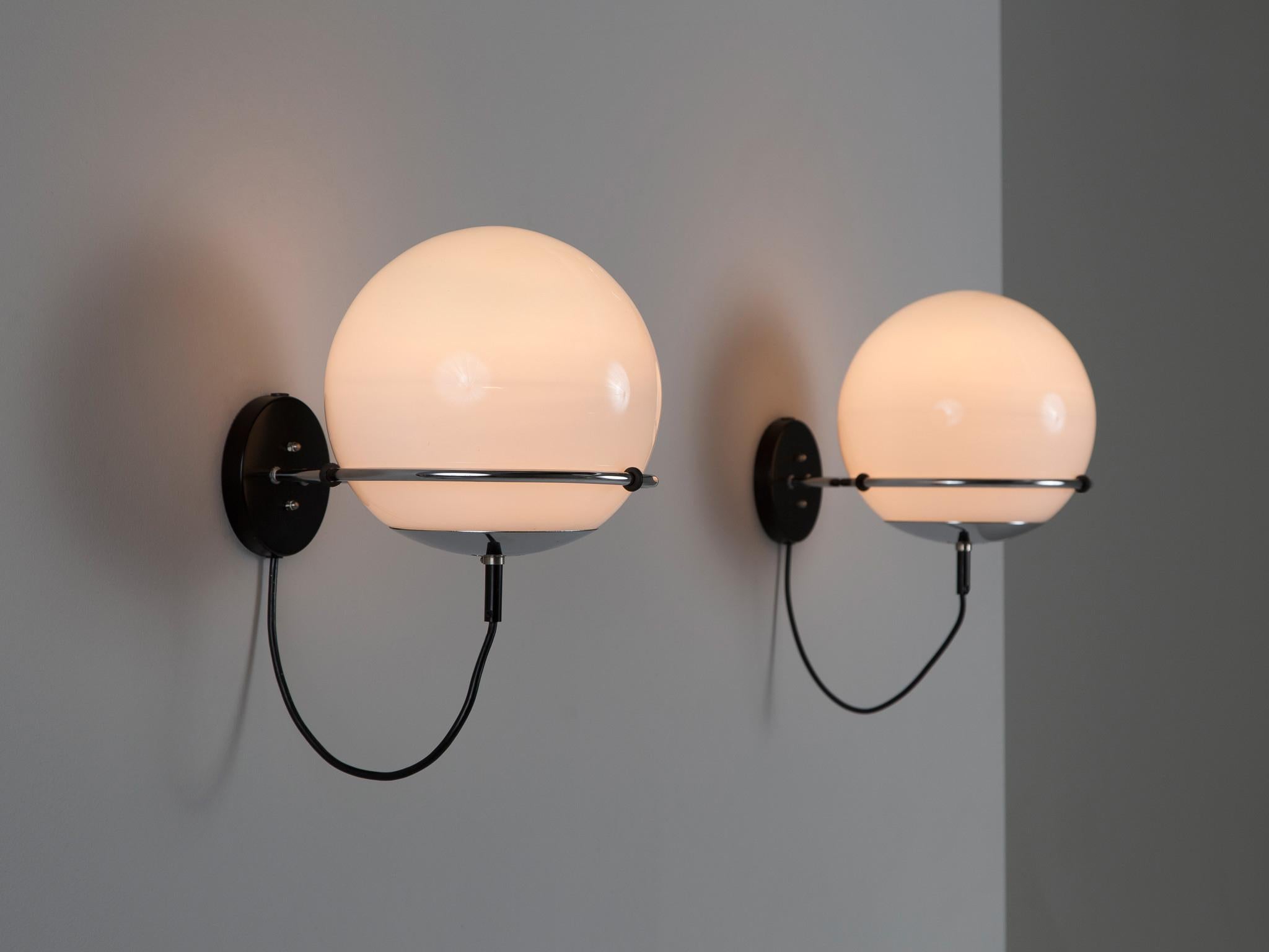 Wall lights, opaline glass, chrome-plated metal, Europe, 1970s. 

These lovely wall lights are suitable for bringing more ambience in one's interior. The construction is based on a wall-mounted system that secures the silver colored ring. The