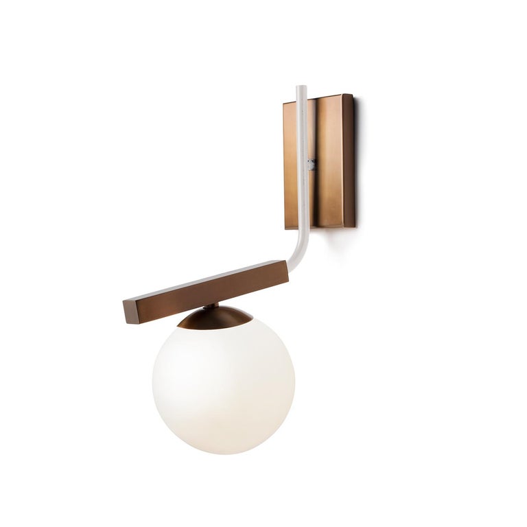 Globe Wall Sconce is a stunning, timeless lamp with a delicate bronze and lacquered metal structure and soft opaque glass globes. Made to Order. 

Part of the Mambo Unlimited Ideas design group, at Utu lamps the lighting field of design is
