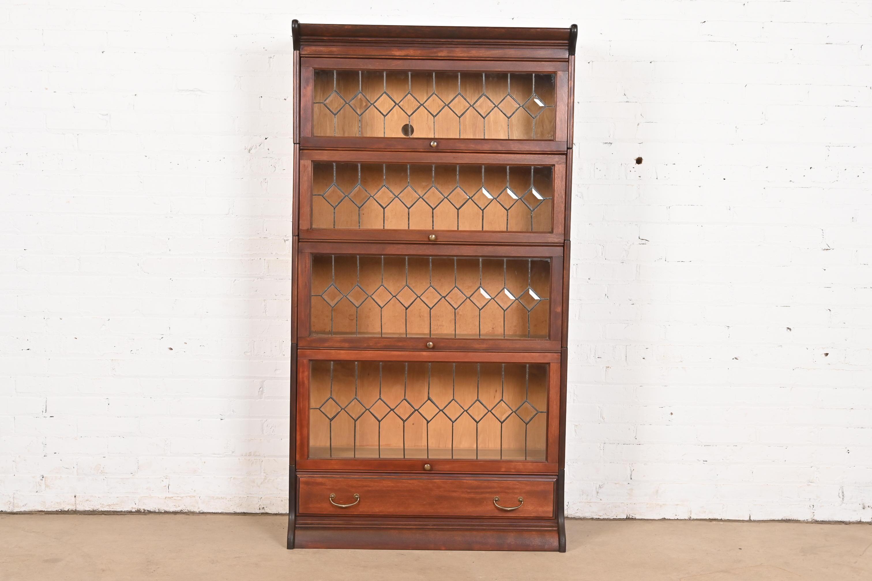 A gorgeous four-stack mahogany barrister bookcase with leaded glass doors

By Globe Wernicke

USA, Circa 1900

Measures: 34.13