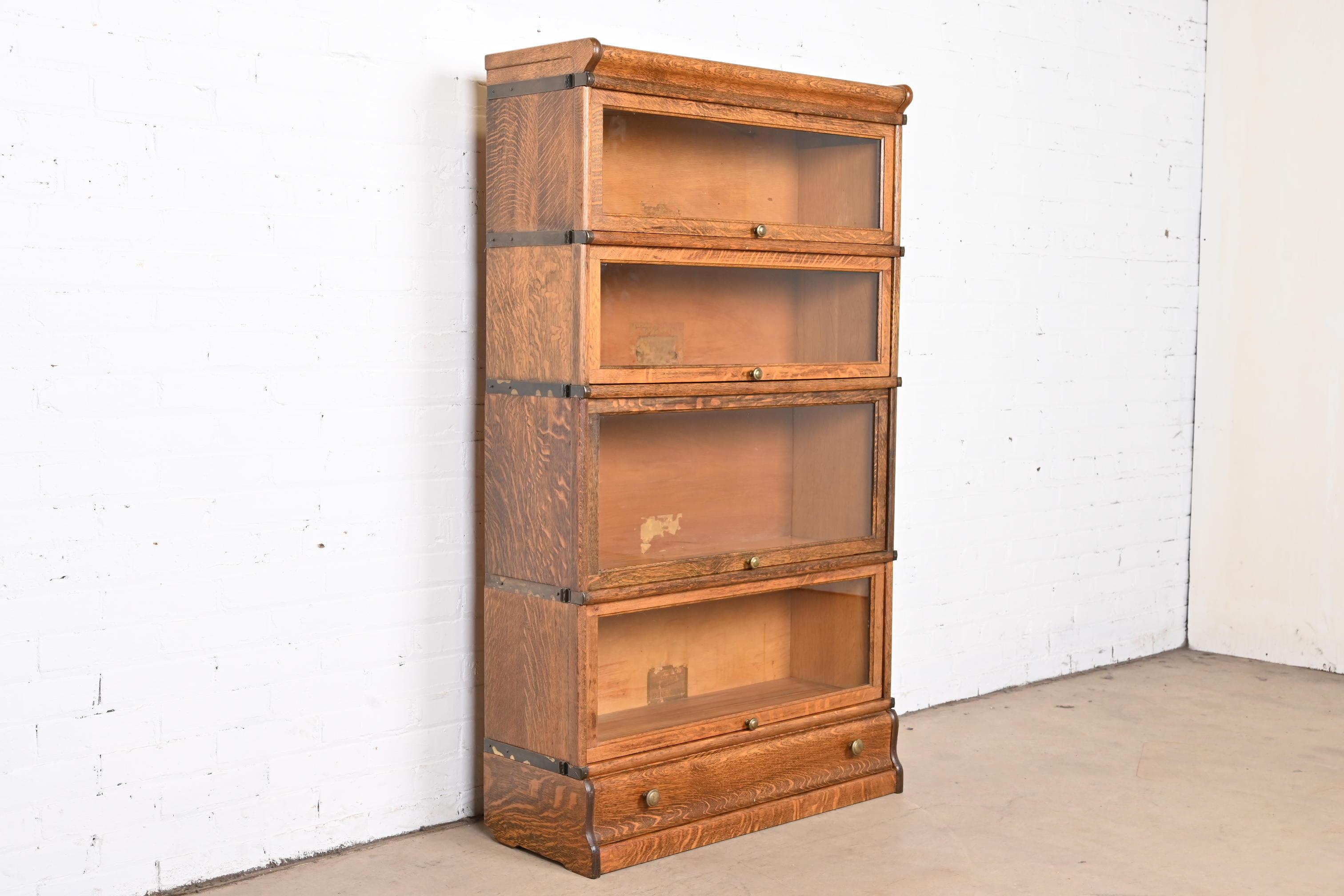 A gorgeous antique Mission or Arts & Crafts four-stack barrister bookcase

By Globe Wernicke

USA, circa 1920s

Quarter sawn oak, with glass front doors and original brass hardware.

Measures: 34