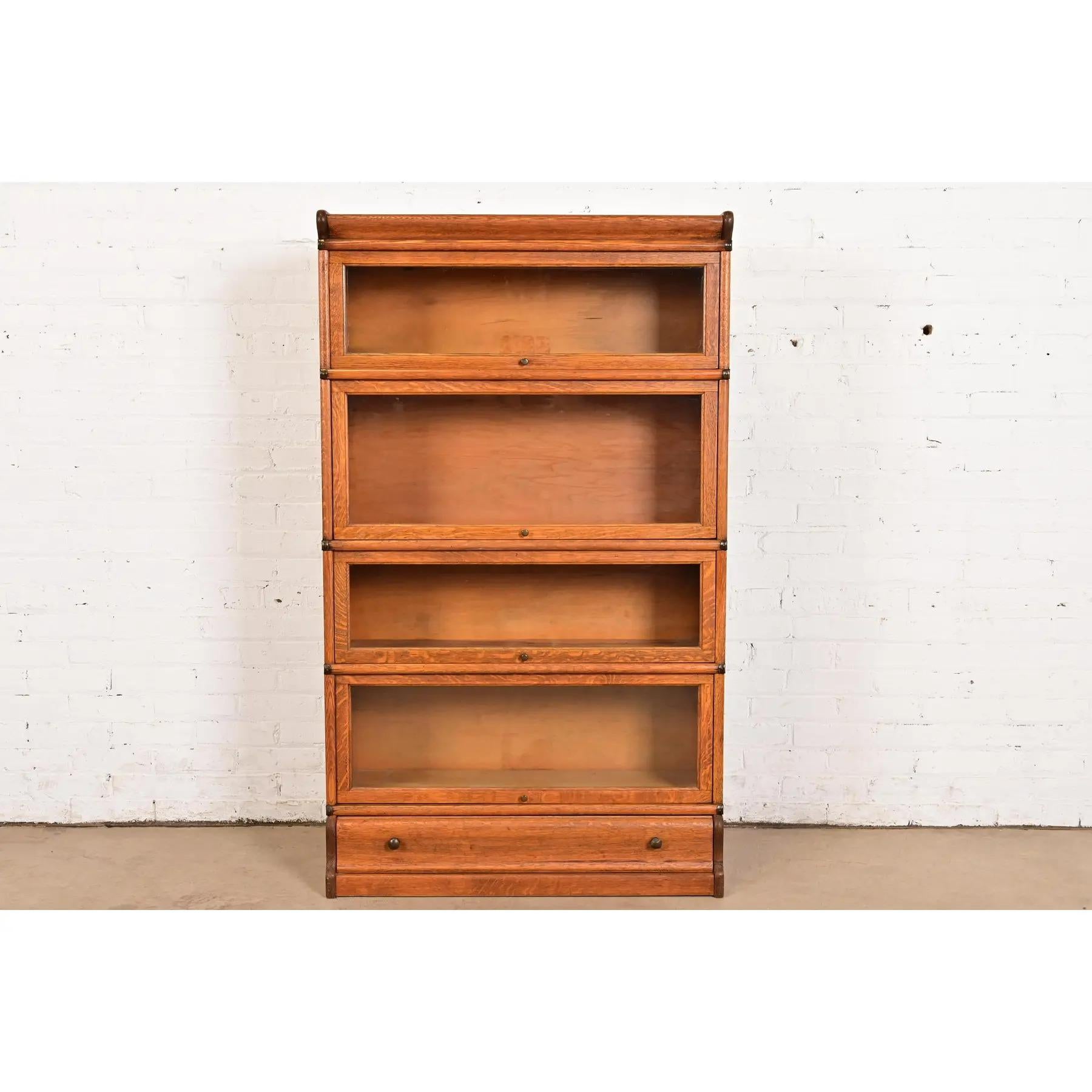 A gorgeous antique Arts & Crafts four-stack barrister bookcase

By Globe Wernicke

USA, Circa 1920s

Quarter sawn oak, with glass front doors, and original brass hardware.

Measures: 34.25