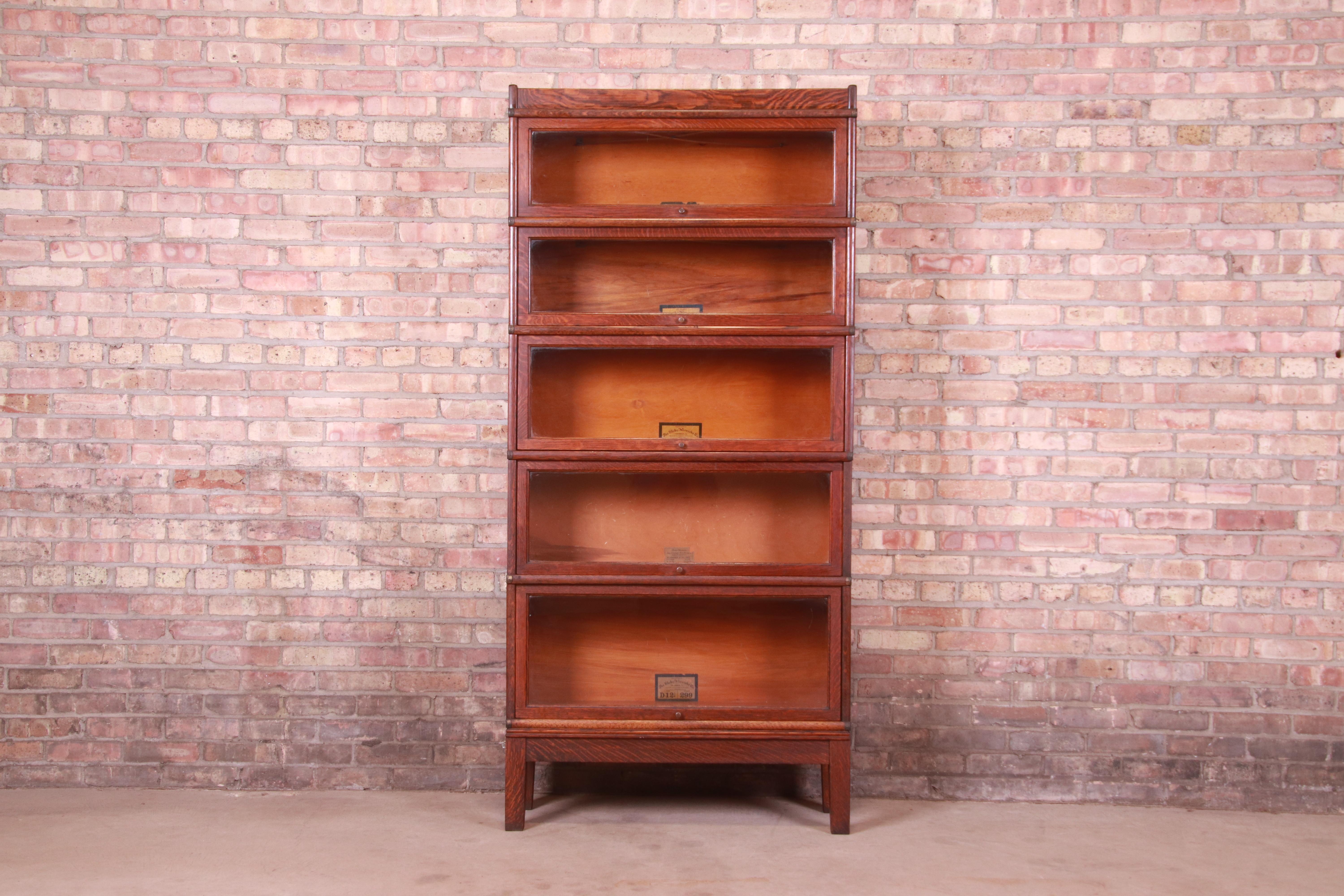 A gorgeous antique Arts & Crafts five-stack barrister bookcase

By Globe Wernicke

USA, Circa 1900

Quartersawn oak, with brass hardware and glass door fronts.

Measures: 34