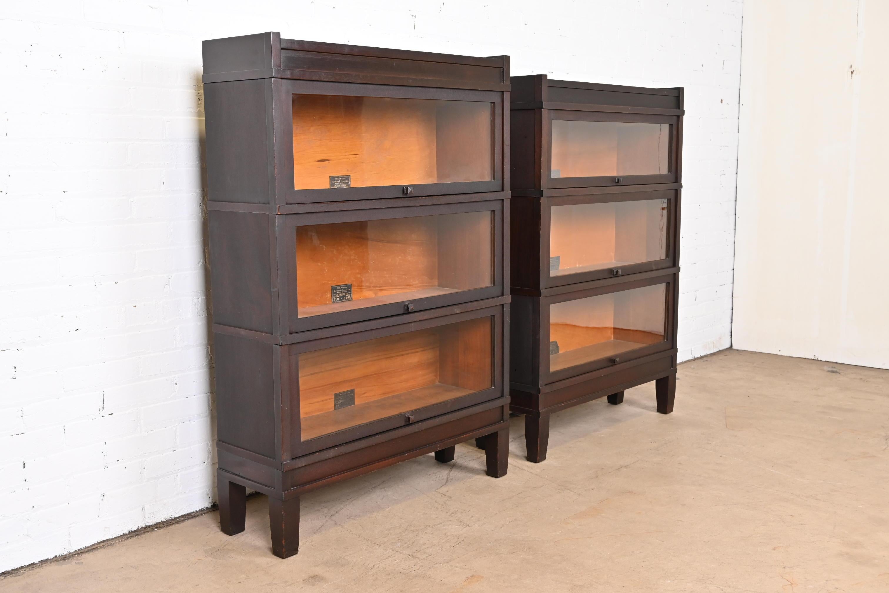 An exceptional pair of antique Mission Arts & Crafts three-stack lawyer barrister bookcases

By Globe Wernicke

USA, Circa 1890s

Mahogany, with glass doors.

Measures:
Bookcase 1 - 34.5