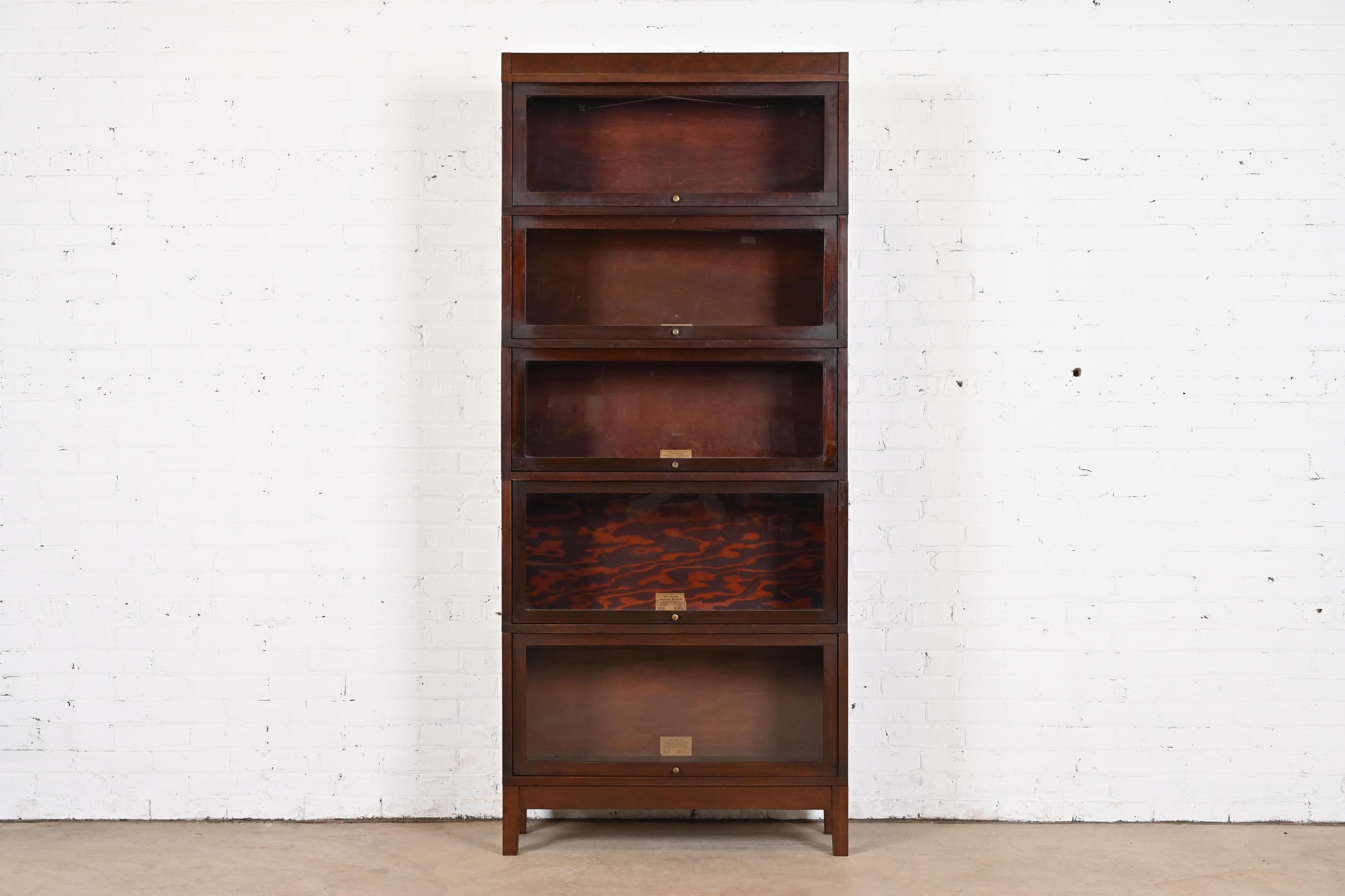 A gorgeous antique Arts & Crafts five-stack barrister bookcase

By Globe Wernicke

USA, Late 19th Century

Mahogany, with glass front doors and brass hardware.

Measures: 34.5