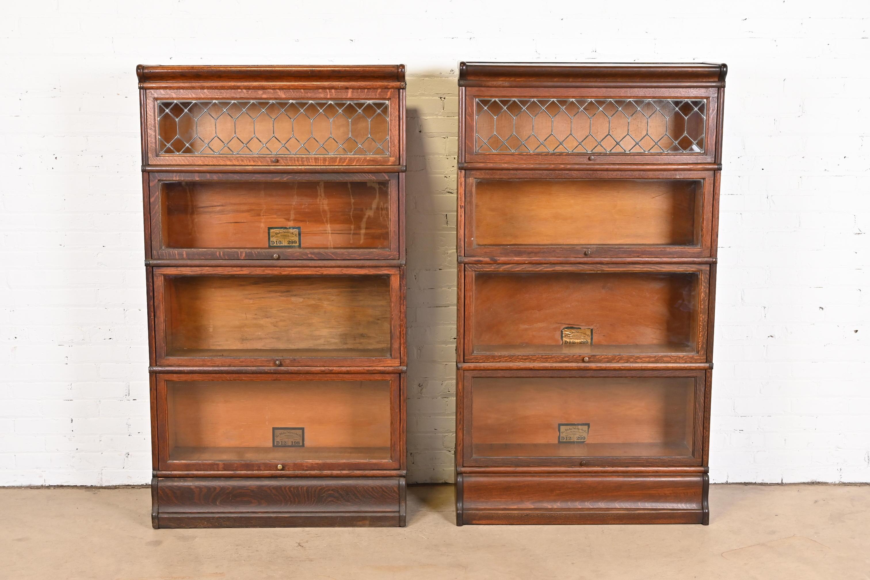 A gorgeous pair of antique Arts & Crafts four-stack barrister bookcases with leaded glass

By Globe Wernicke

USA, circa 1900

Quartersawn oak, with glass front doors and brass hardware.

Measures: 34