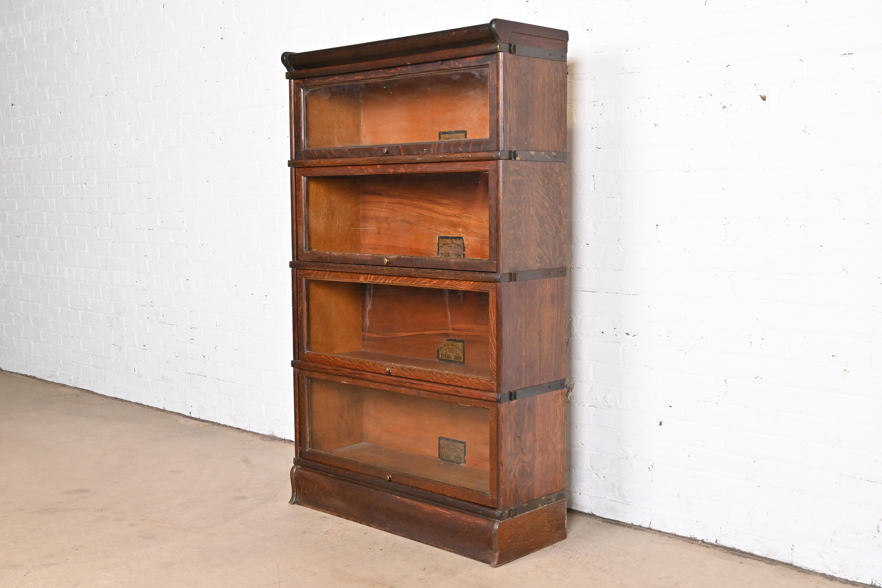 A gorgeous antique Arts & Crafts four-stack barrister bookcase

By Globe Wernicke

USA, circa 1920s

Quartersawn oak, with original brass hardware and glass door fronts.

Measures: 34