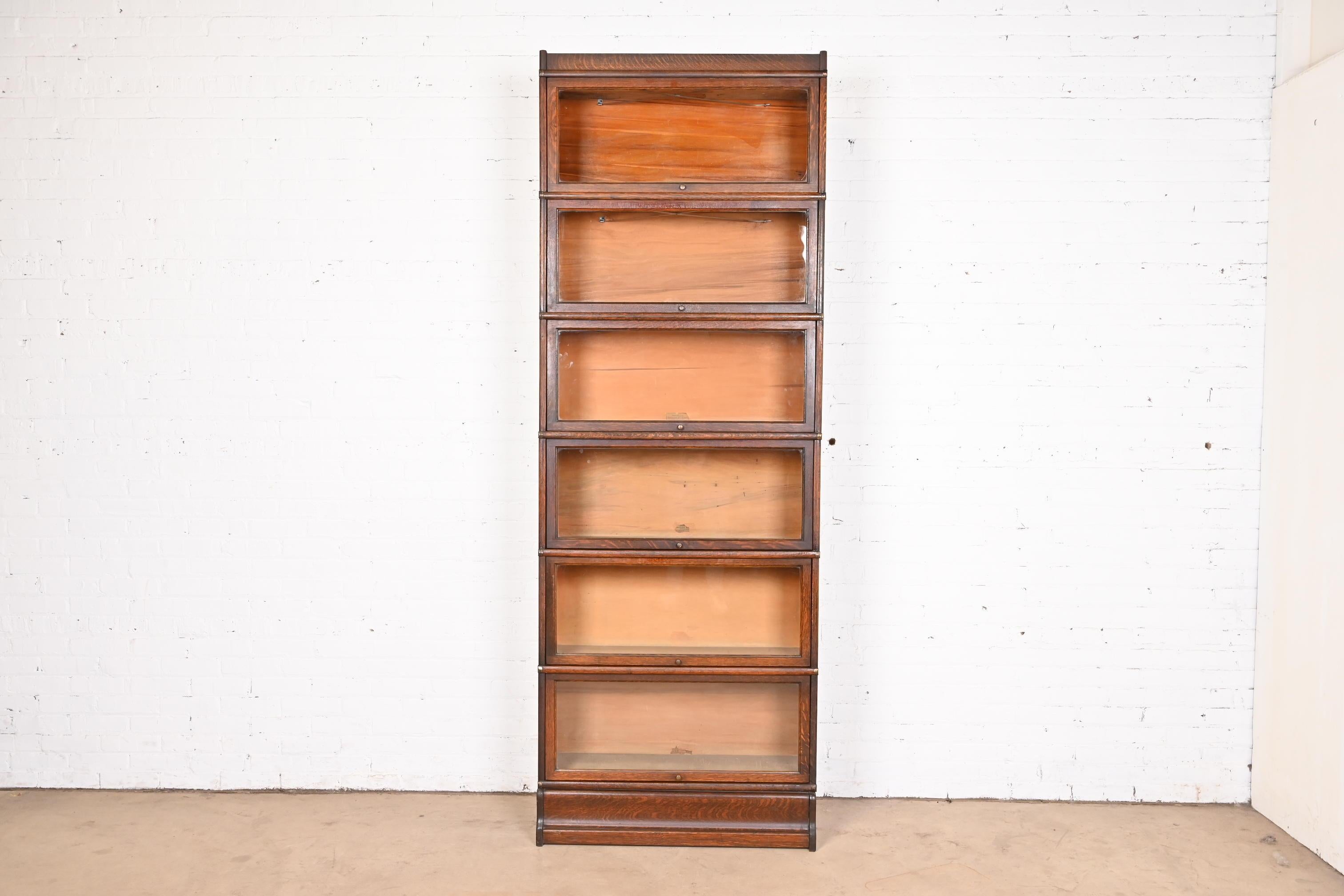 A gorgeous antique Arts & Crafts six-stack barrister bookcase

By Globe Wernicke

USA, Circa 1920s

Quartersawn oak, with original brass hardware and glass door fronts.

Measures: 34