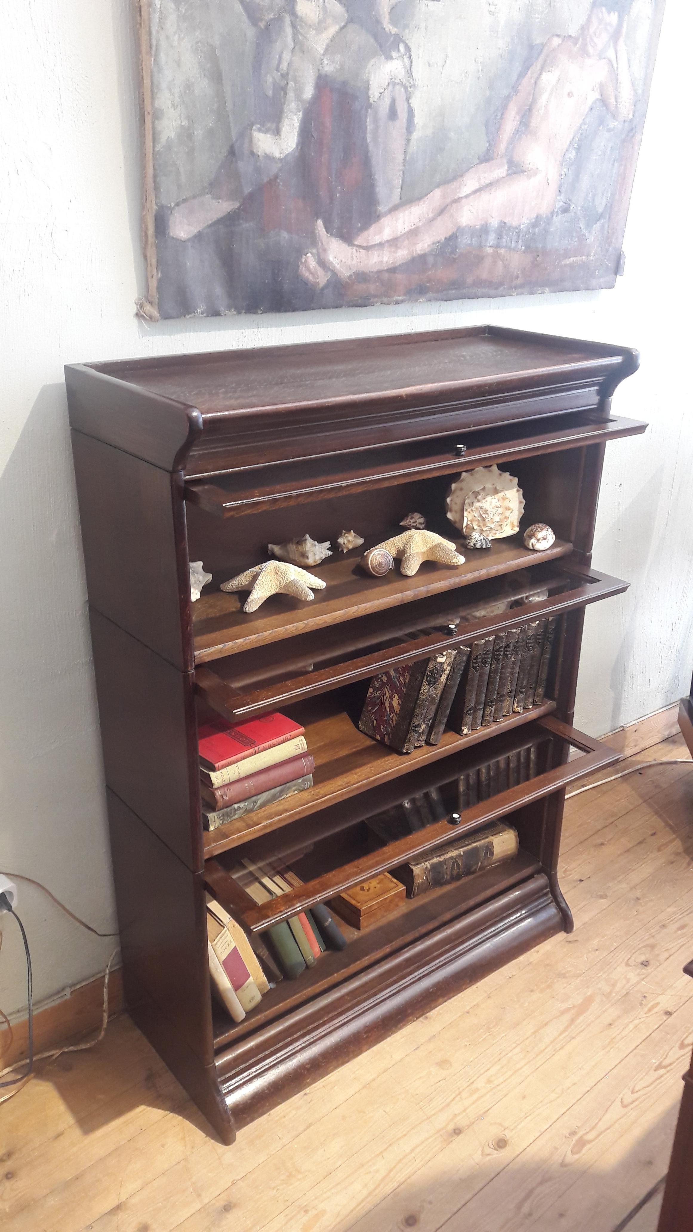 A three section Globe Wernick in oak. All the parts are easily detachable.