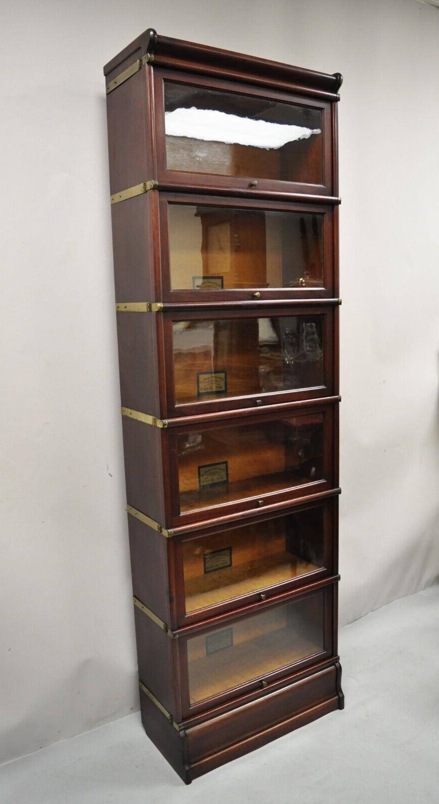 Globe Wernicke D10 1/4 S Grade 598 1/2 Mahogany 6 Section Barrister lawyers bookcase. Item features (6) stacking sections, (1) top,(1) base, size D 10 1/4 S, Grade 598 1/2, mahogany case, sliding glass doors, very rare narrow size. Circa Early