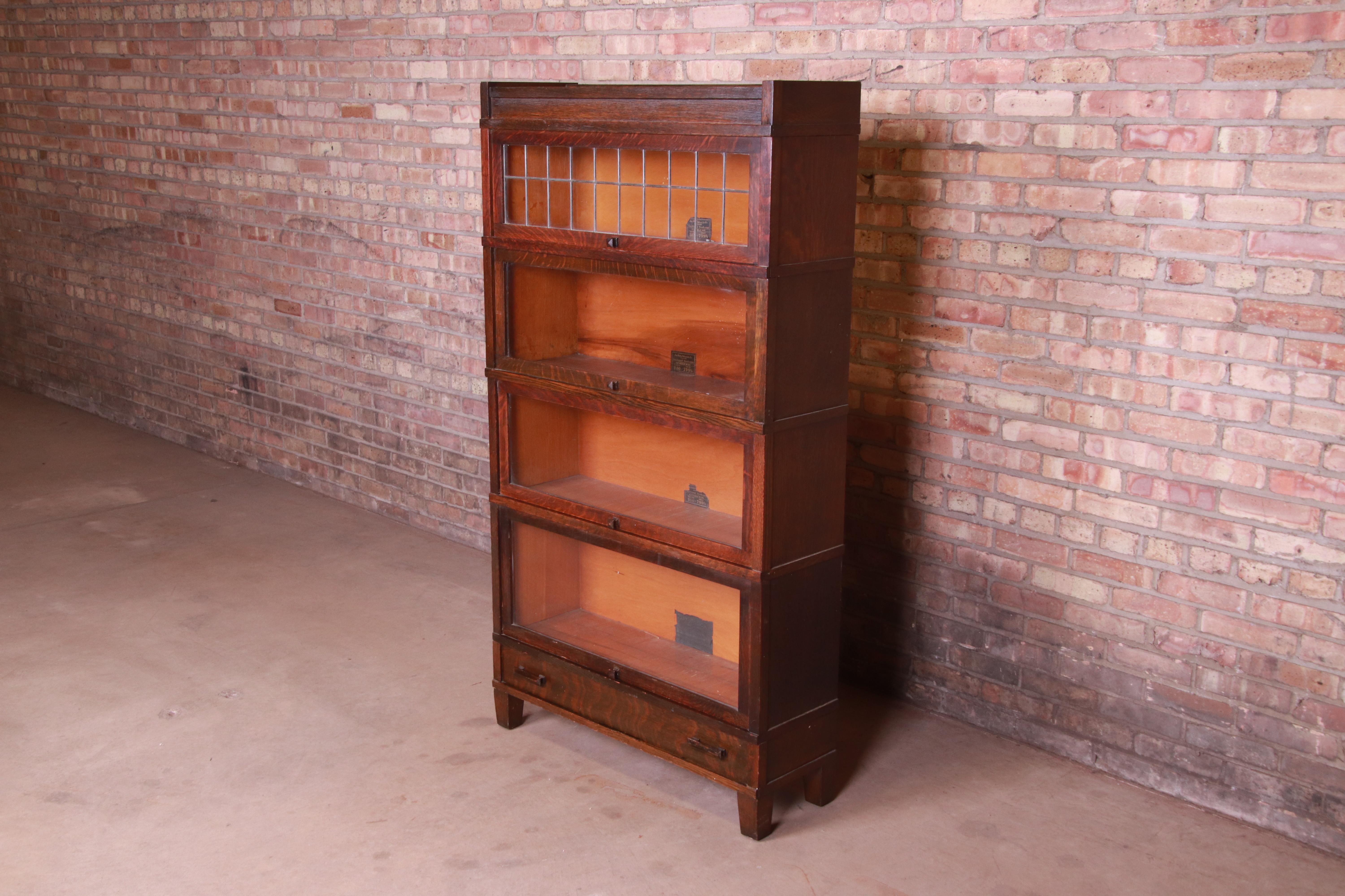 Arts and Crafts Globe Wernicke Four-Stack Oak Barrister Bookcase with Leaded Glass, circa 1920s