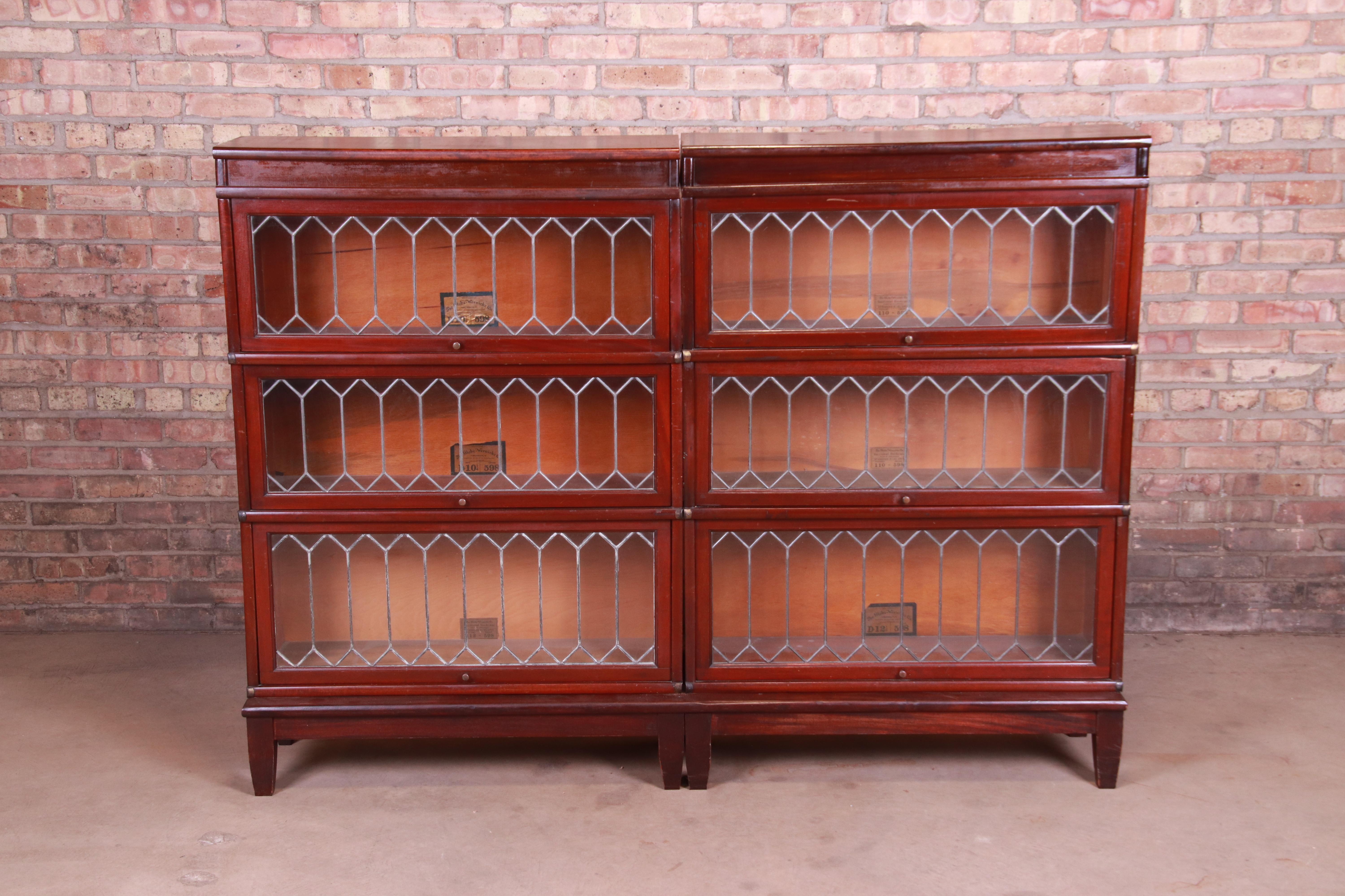An exceptional antique Arts & Crafts side by side three-stack barrister bookcase

By Globe Wernicke

USA, circa 1920s

Mahogany, with leaded glass doors.

Measures: 68.13