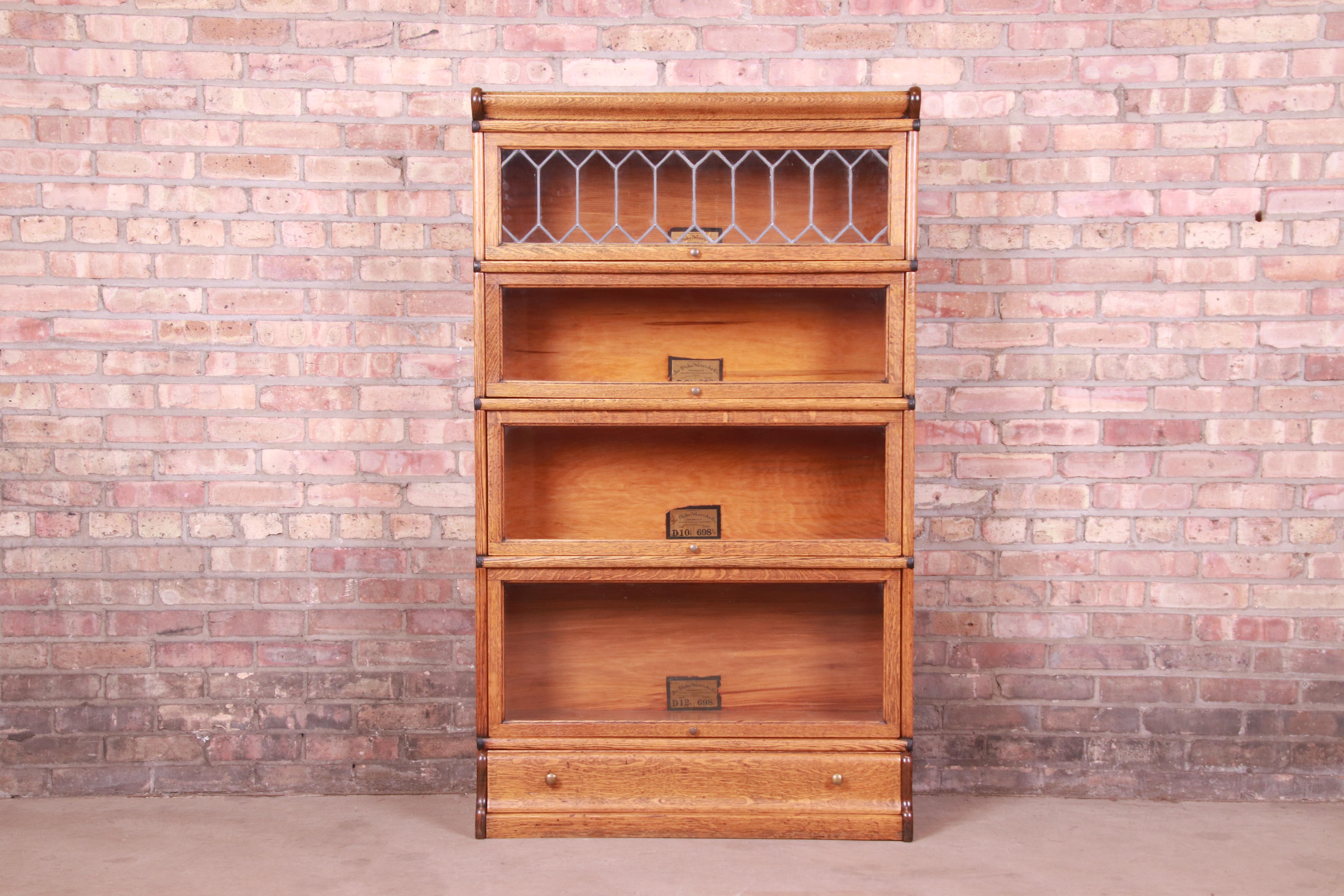 A gorgeous antique Arts & Crafts four-stack barrister bookcase with leaded glass

By Globe Wernicke

USA, Circa 1900

Quartersawn oak, with glass front doors and original brass hardware.

Measures: 34