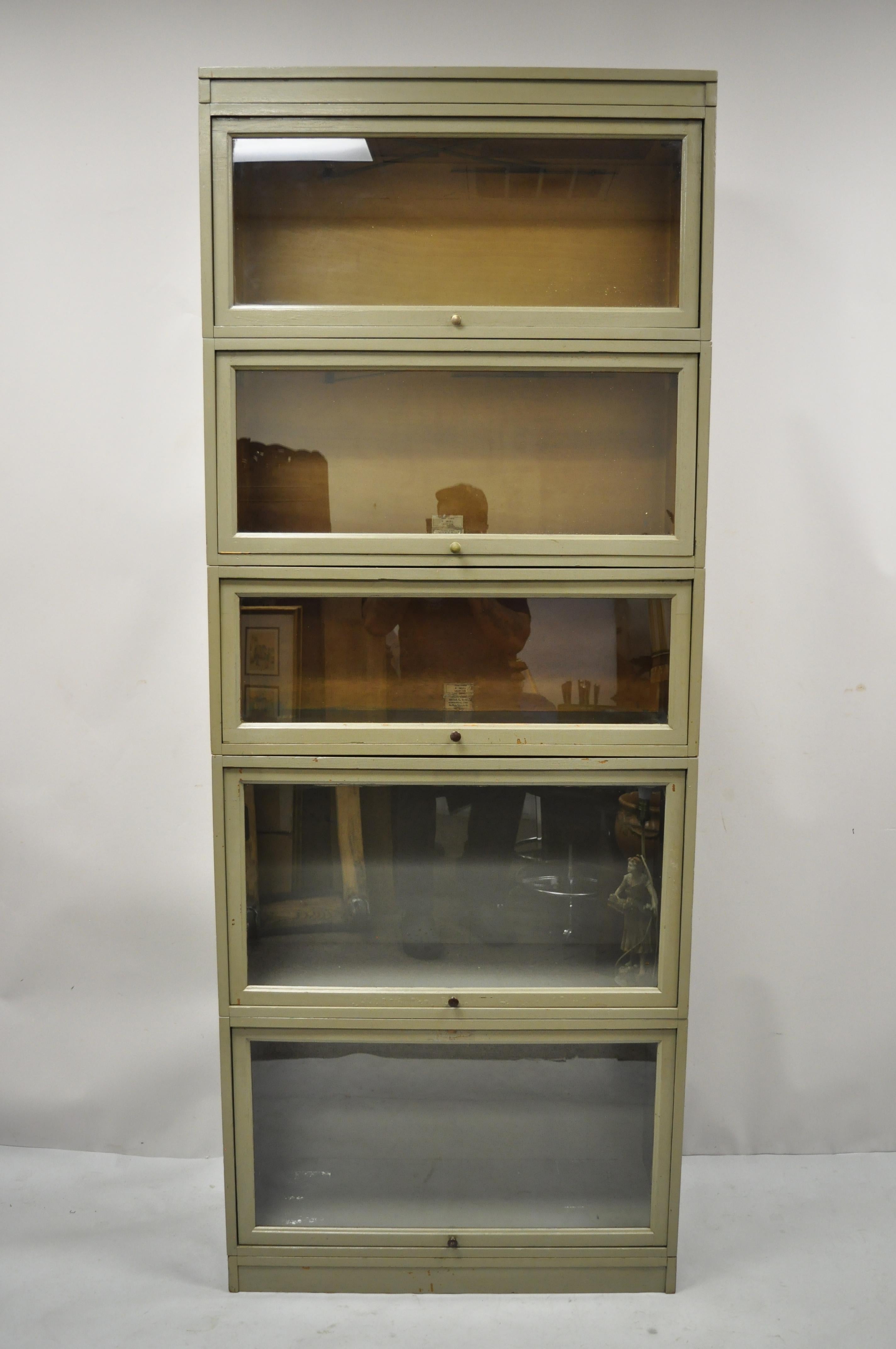 Antique Globe Wernicke oak panel side green 5 section Stacking Barrister Lawyer's bookcase. Item features 5 bookcase sections, sliding glass doors, panel sides, oak wood construction, beautiful wood grain, 7 part construction, original labels, very