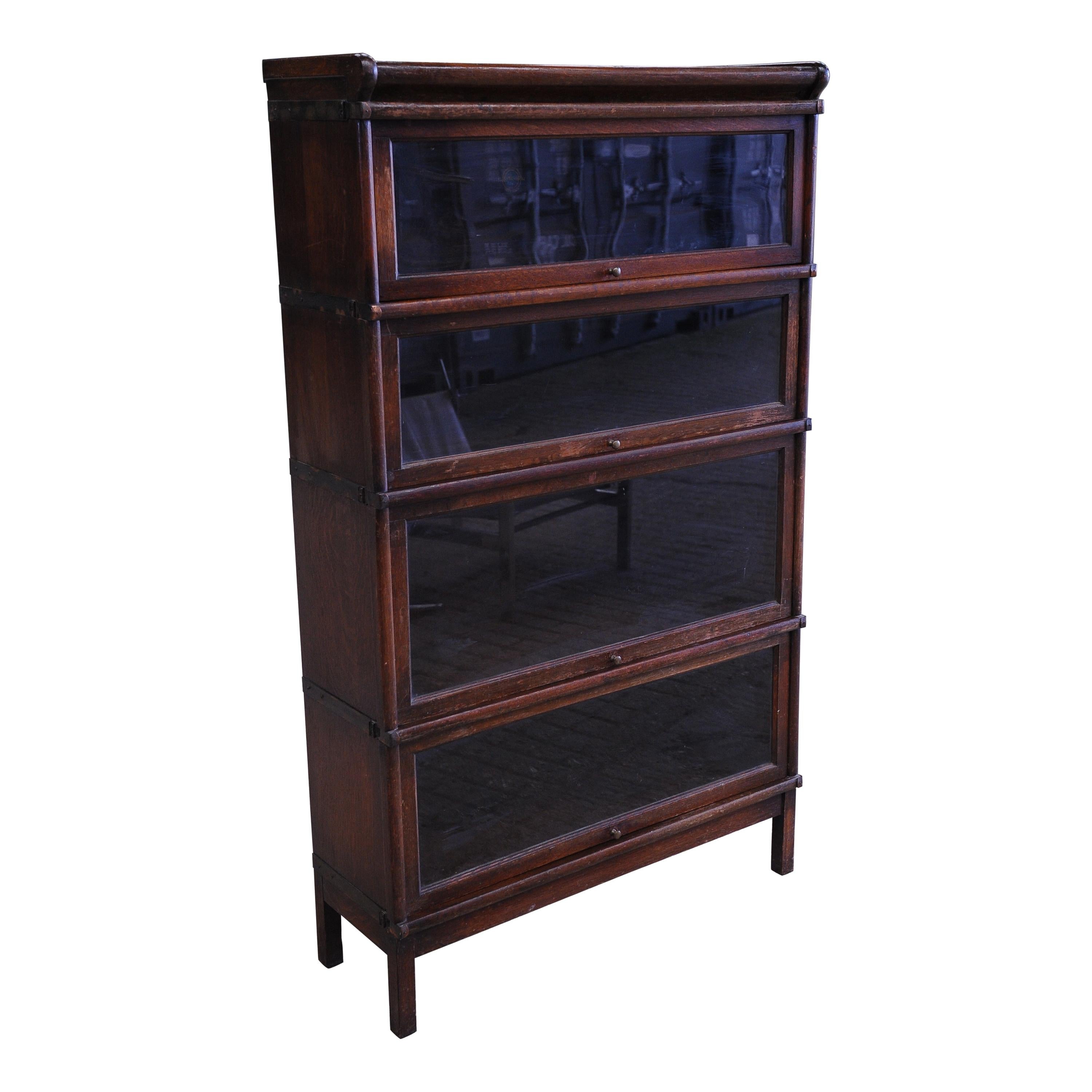 Globe Wernicke Sectional Oak Bookcase, 4Tiered with Glazed Pull Down Fronts For Sale at 1stDibs