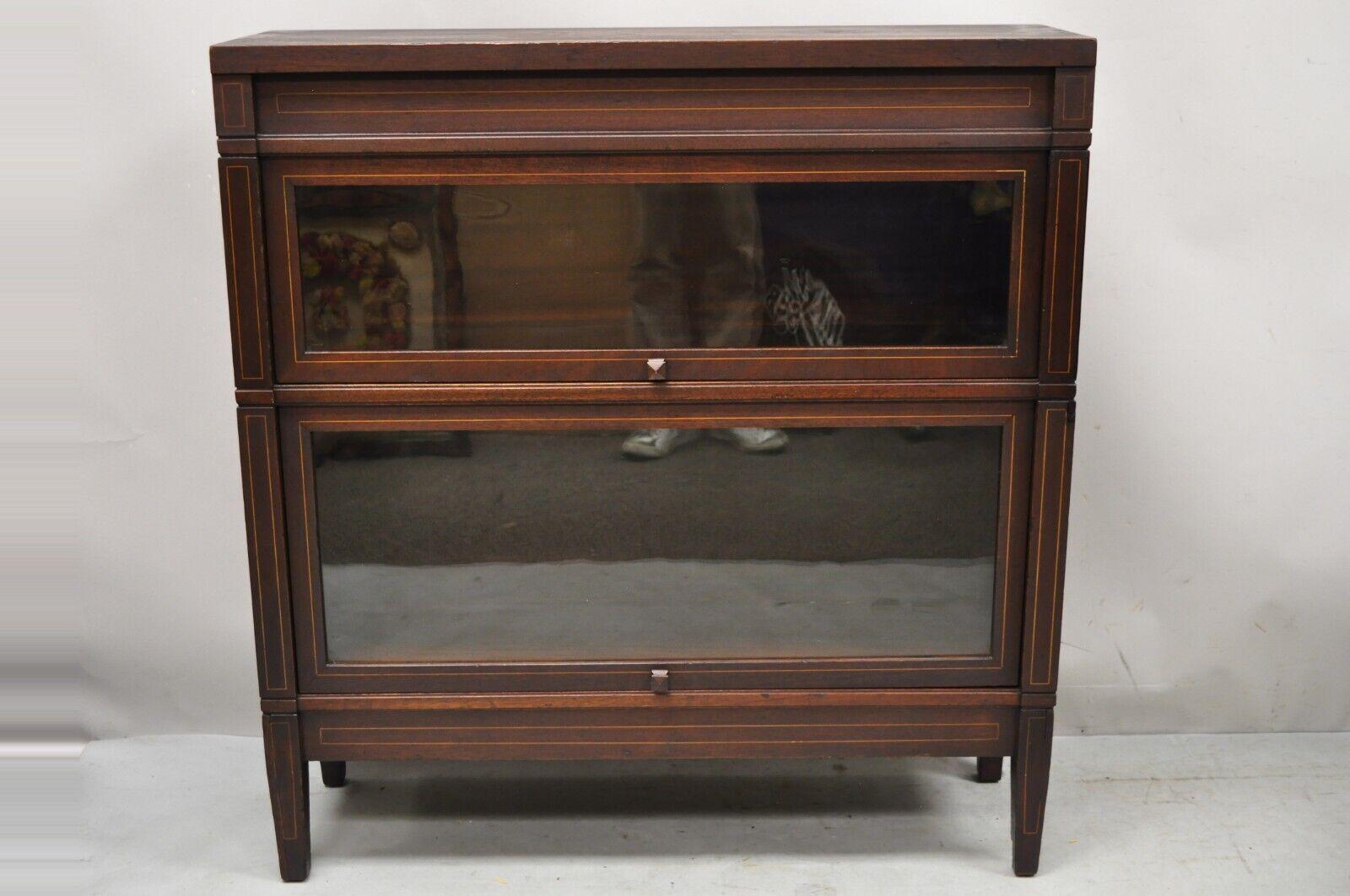 Antique Globe Wernicke Sheraton mahogany 2 Section Stacking Barrister Lawyers Bookcase. Item features satinwood pencil inlay, 2 sliding glass doors, 4 part construction, original label, very nice antique item, quality American craftsmanship, 2