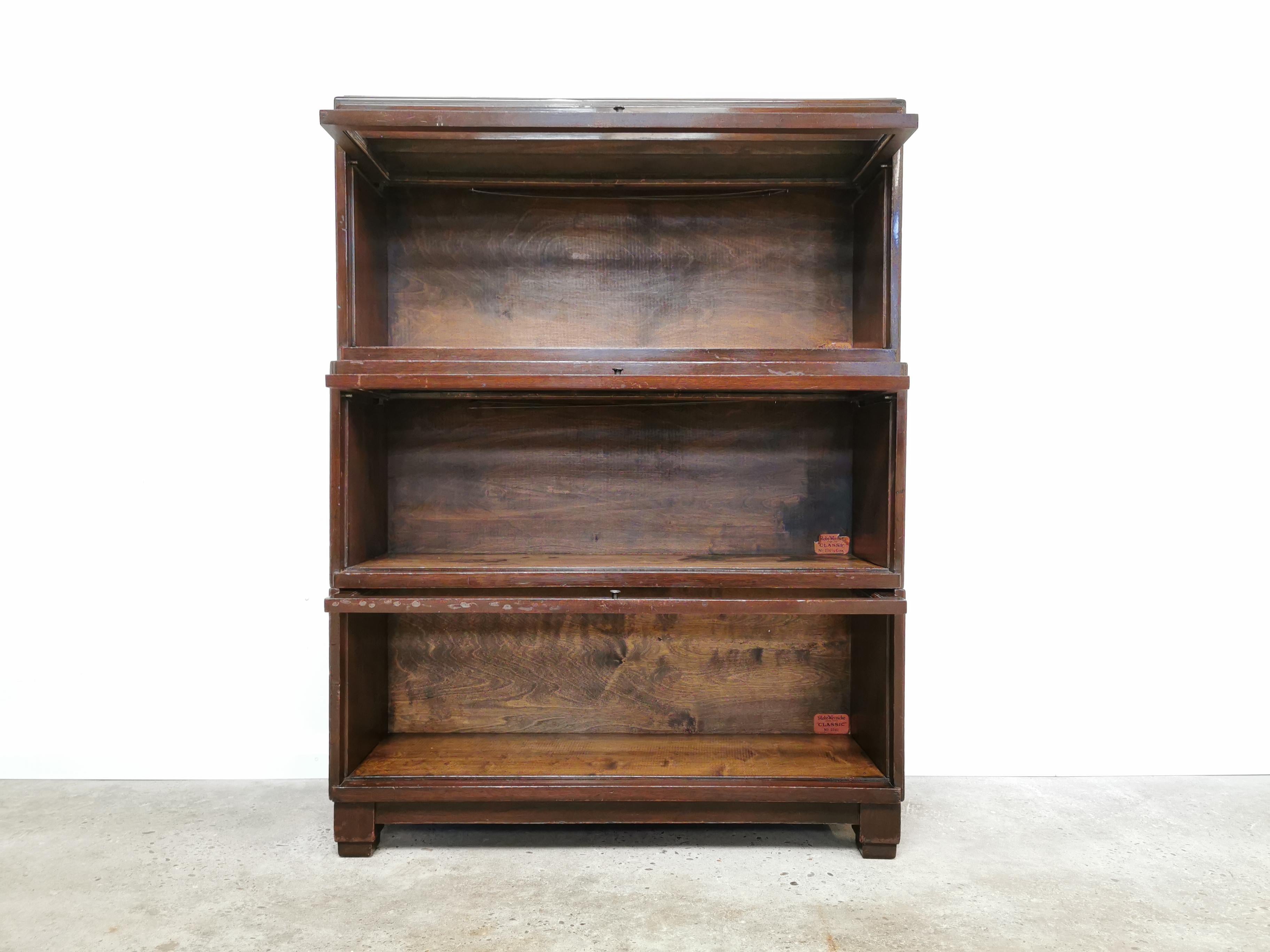 The Globe Wernicke bookcase system was produced in England, America, and Germany. The mobile office was popular among researchers who took the furniture on their travels. Typical for the Globe-Wernicke bookcases are the patented retractable glass