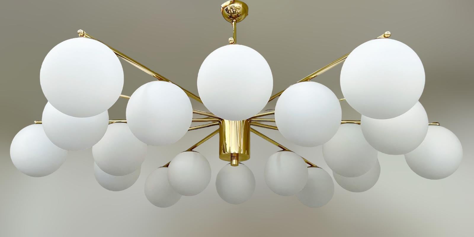 Italian chandelier with Murano globes mounted on solid brass frame / Made in Italy
Designed by Fabio Ltd, inspired by Angelo Lelli and Arredoluce styles
18 lights / E12 or E14 type / max 40W each 
Diameter: 65 inches / Height: 27 inches including