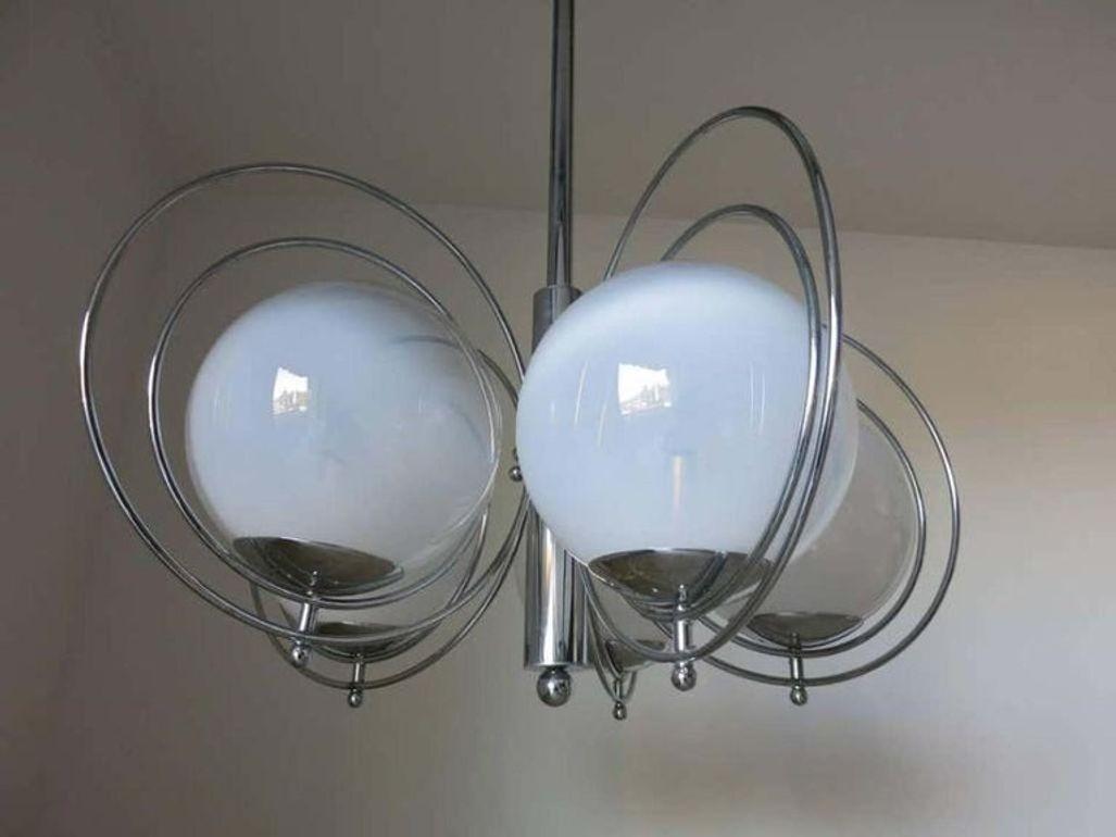 Vintage Italian pendant chandelier with five glossy white Murano glass globes and chrome frame / Designed by Goffredo Reggiani circa 1960s / Made in Italy.