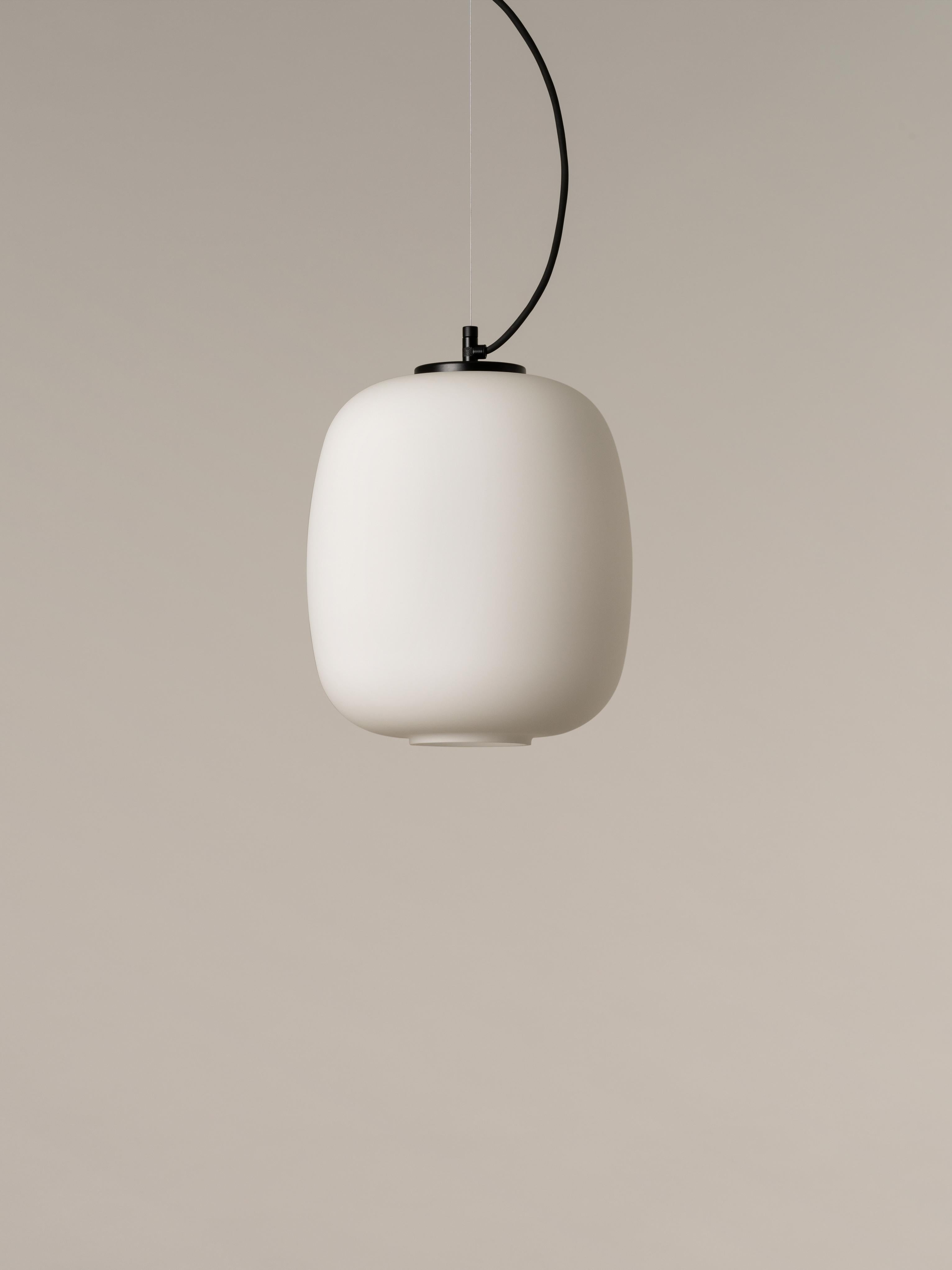 Globo Cesta pendant lamp by Miguel Milá
Dimensions: D 27 x H 31 cm
Materials: Metal, glass.

Freed from its well-known wooden structure, the opal glass now shines on its own, attaining the elegance of a classic with an entirely contemporary