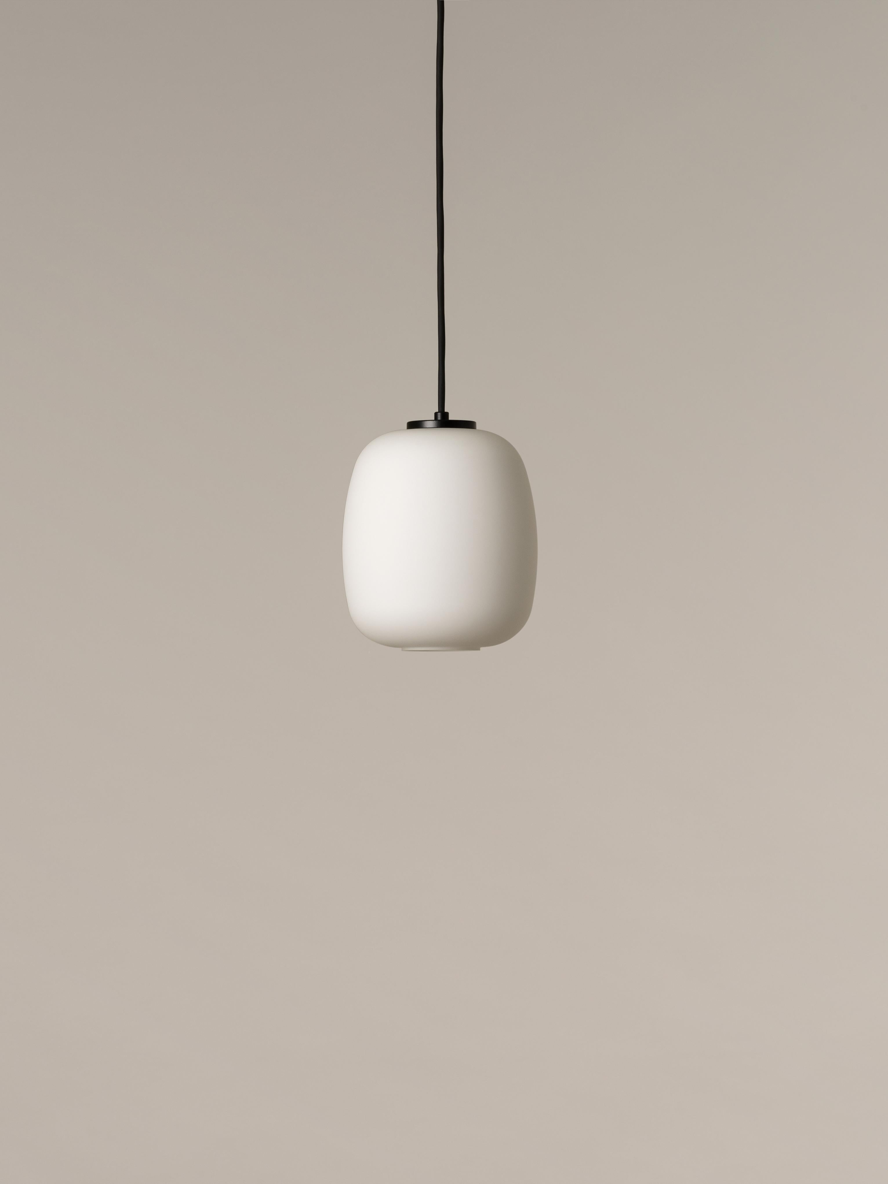 Globo Cestita pendant lamp by Miguel Milá
Dimensions: D 17 x H 21 cm
Materials: metal, glass.

Freed from its well-known wooden structure, the opal glass now shines on its own, attaining the elegance of a classic with an entirely contemporary