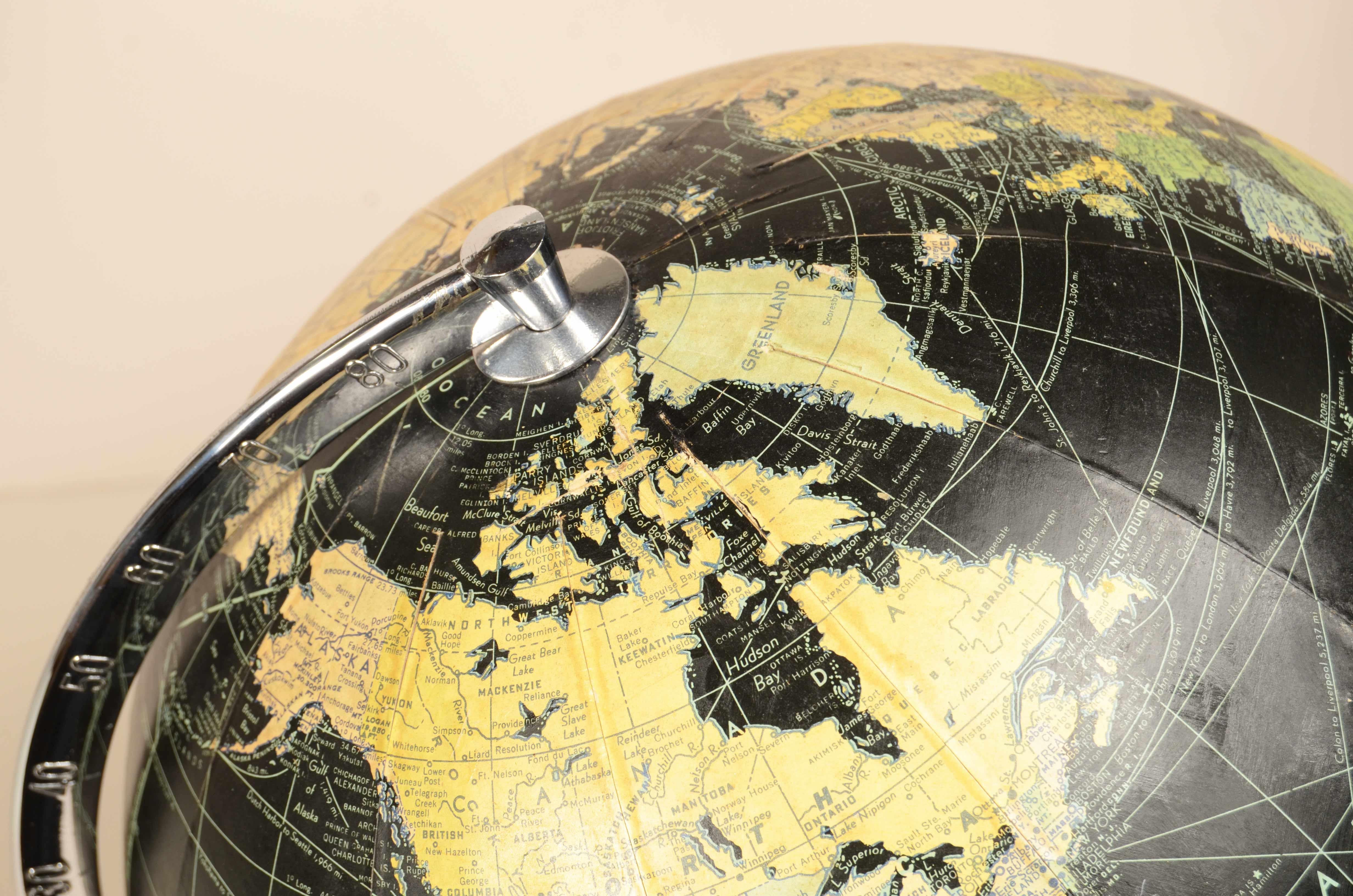 Earth globe with airplane-shaped base published in 1949 by Weber Costello Co. 12