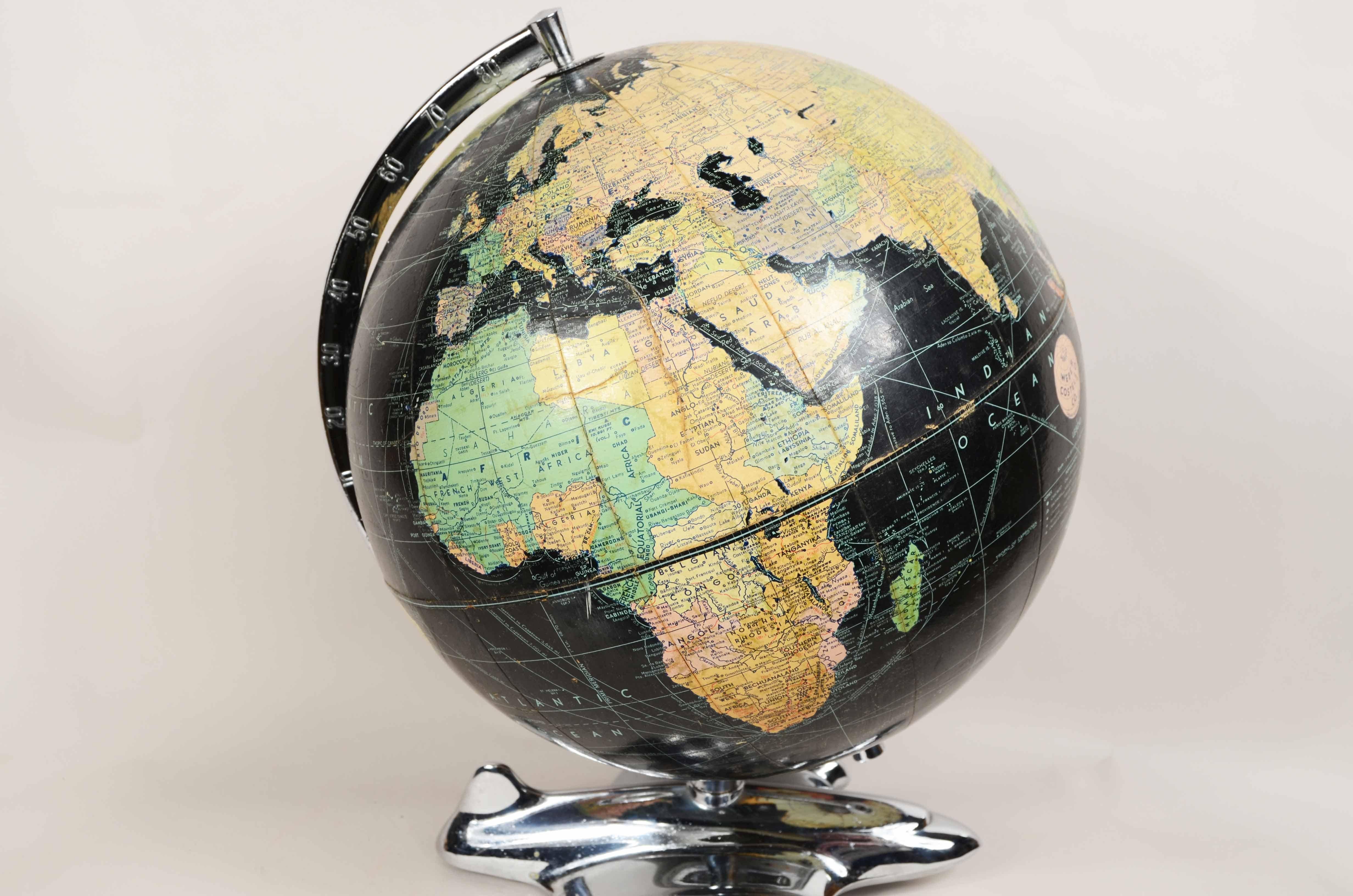 Mid-20th Century Earth globe with airplane-shaped base published in 1949 by Weber Costello Co.  For Sale